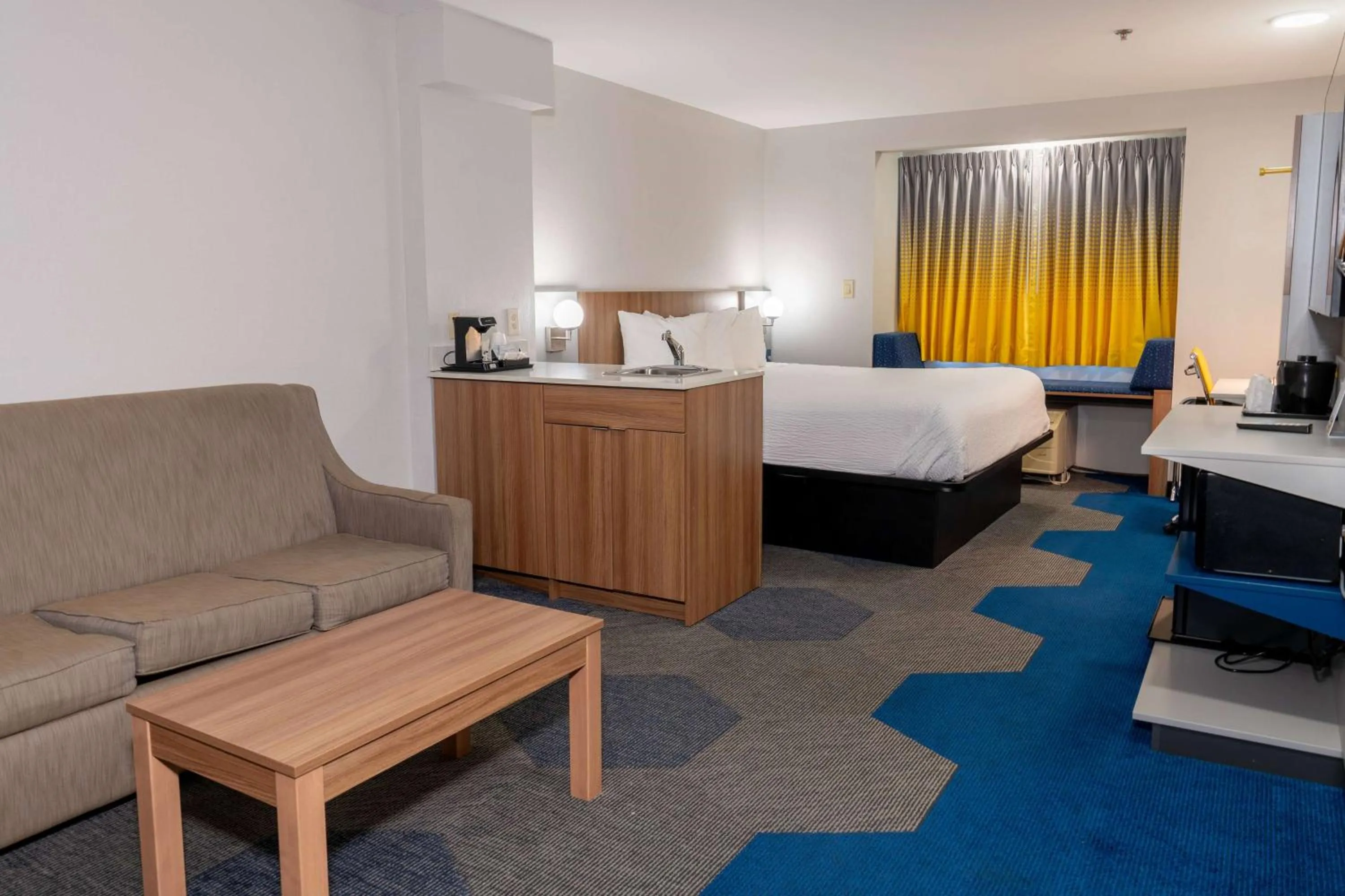 Bed in Microtel Inn & Suites by Wyndham Pigeon Forge