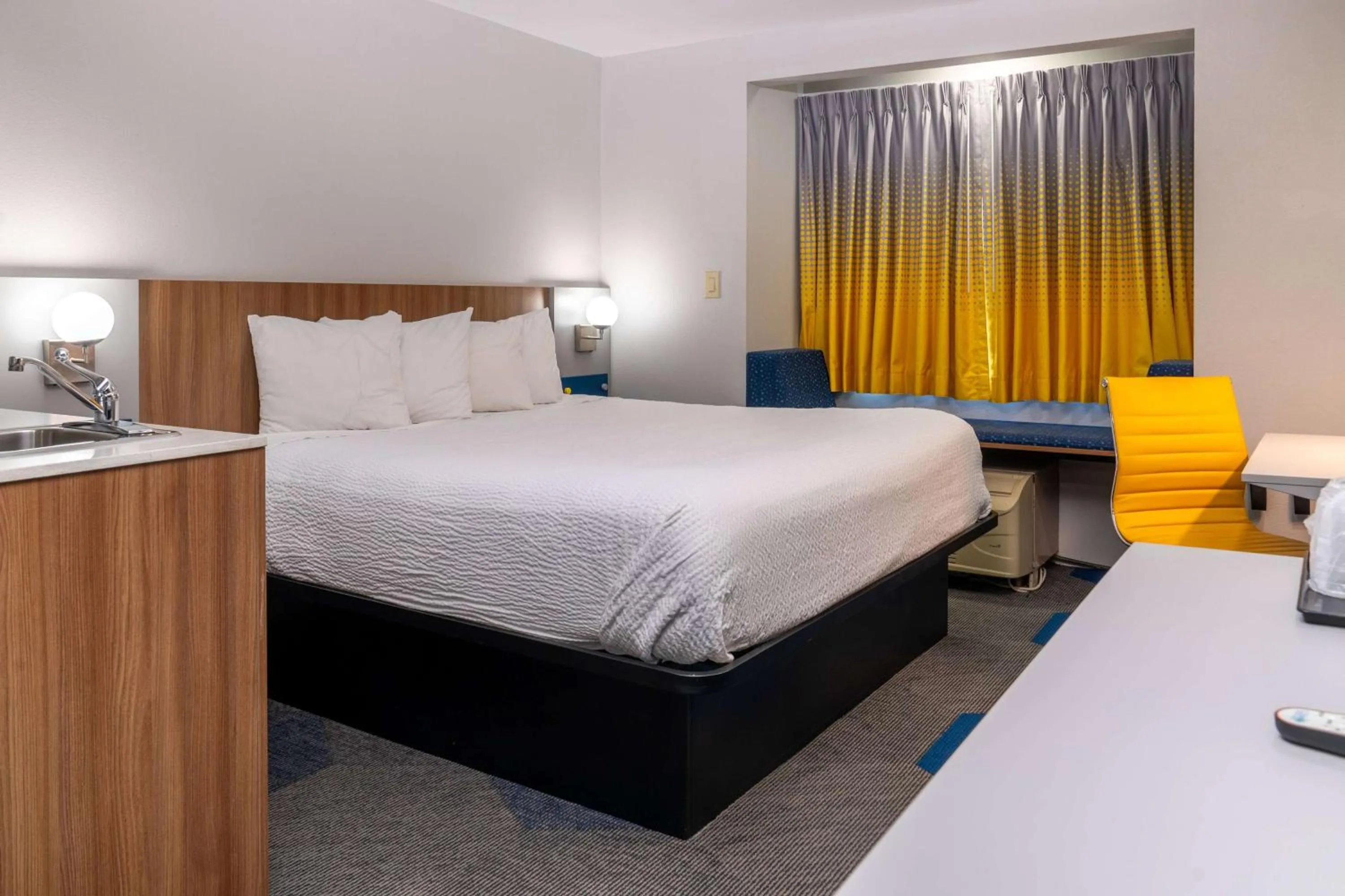 Bed in Microtel Inn & Suites by Wyndham Pigeon Forge