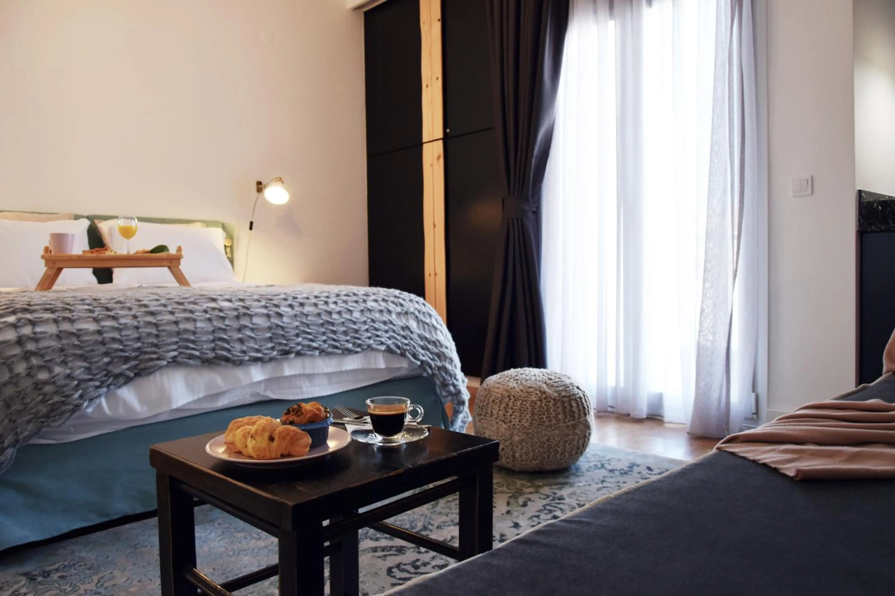 Bed in Grey Studios by Skg Apartments