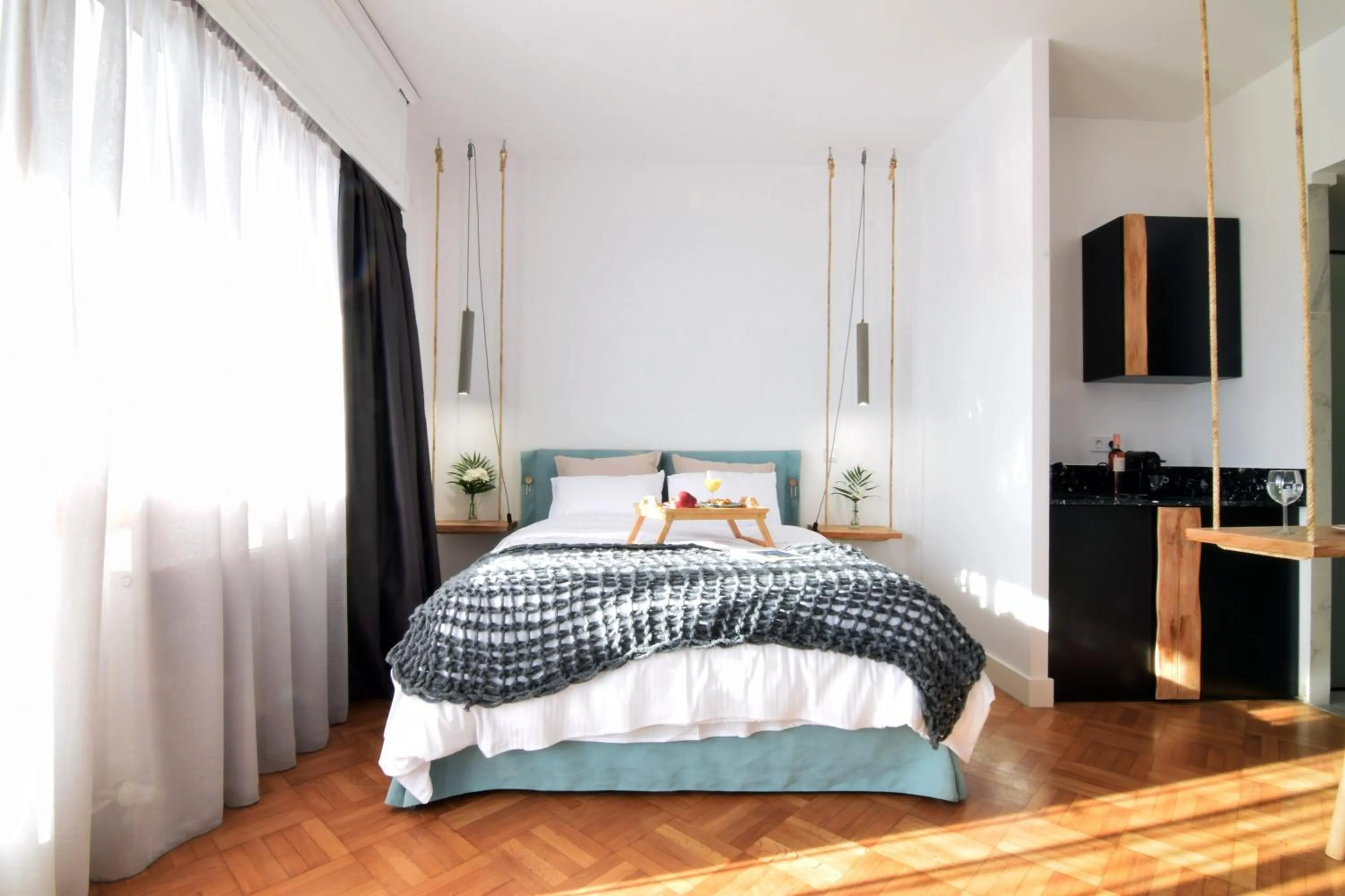 Bed in Grey Studios by Skg Apartments