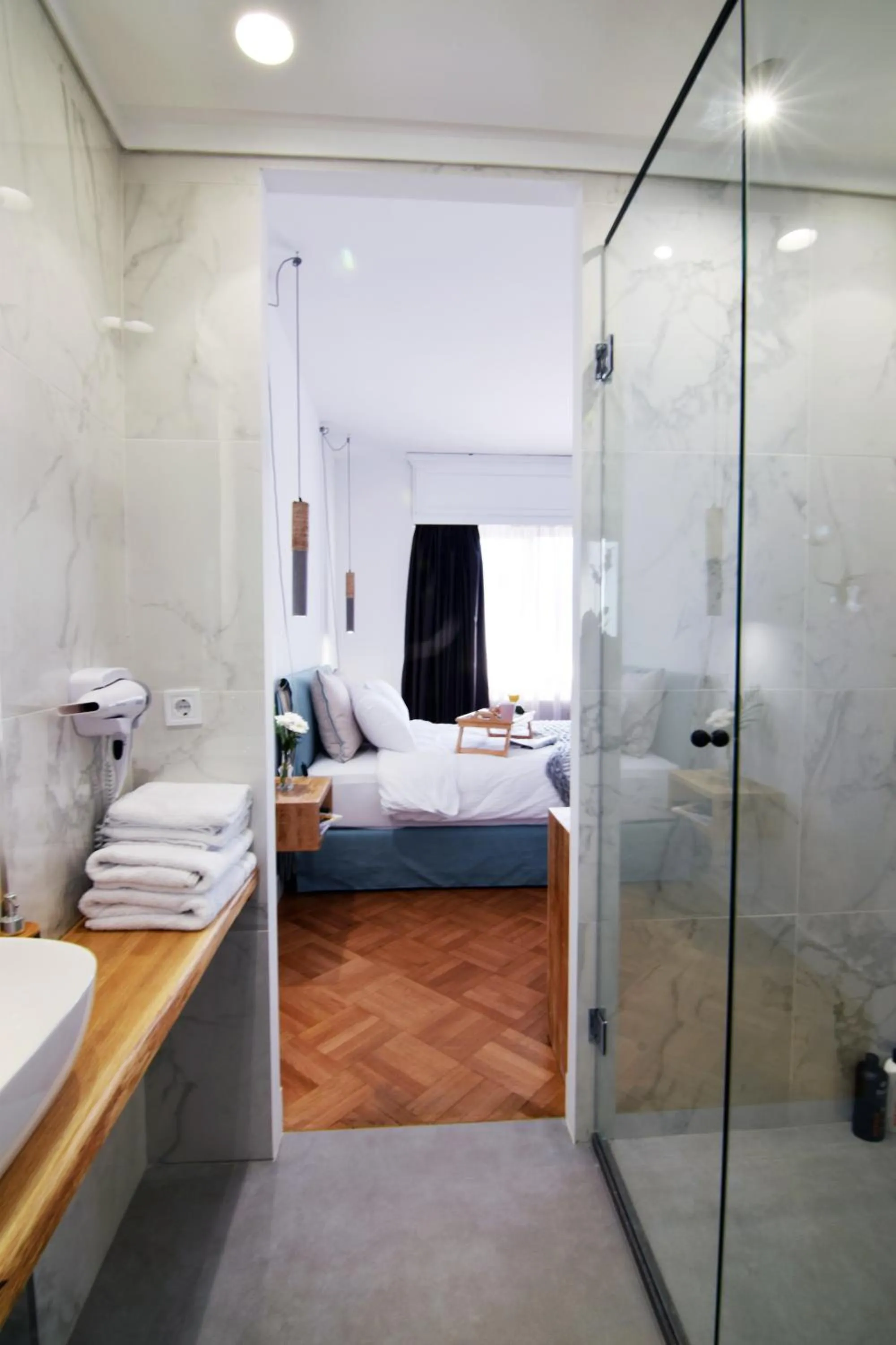 Bed in Grey Studios by Skg Apartments