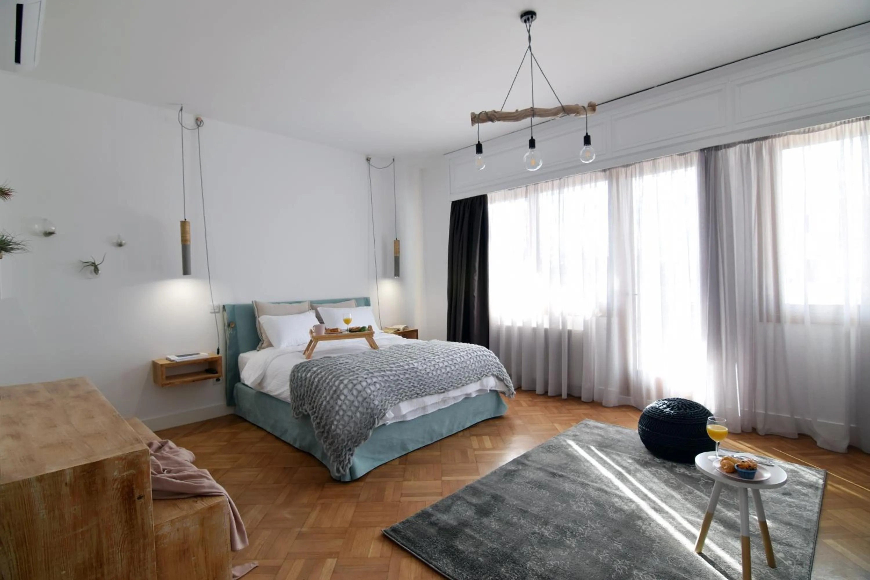 Bed in Grey Studios by Skg Apartments
