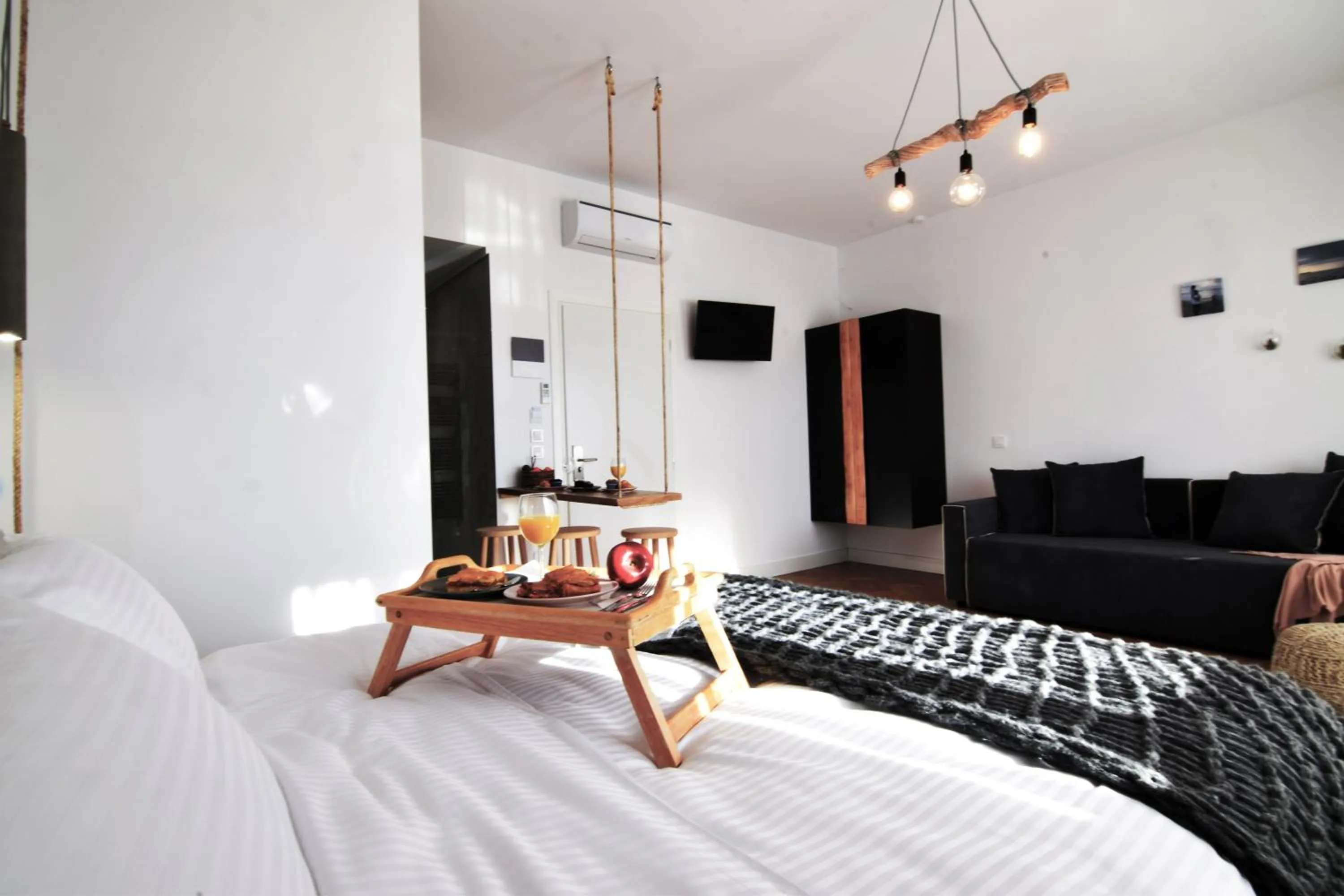 Bed in Grey Studios by Skg Apartments