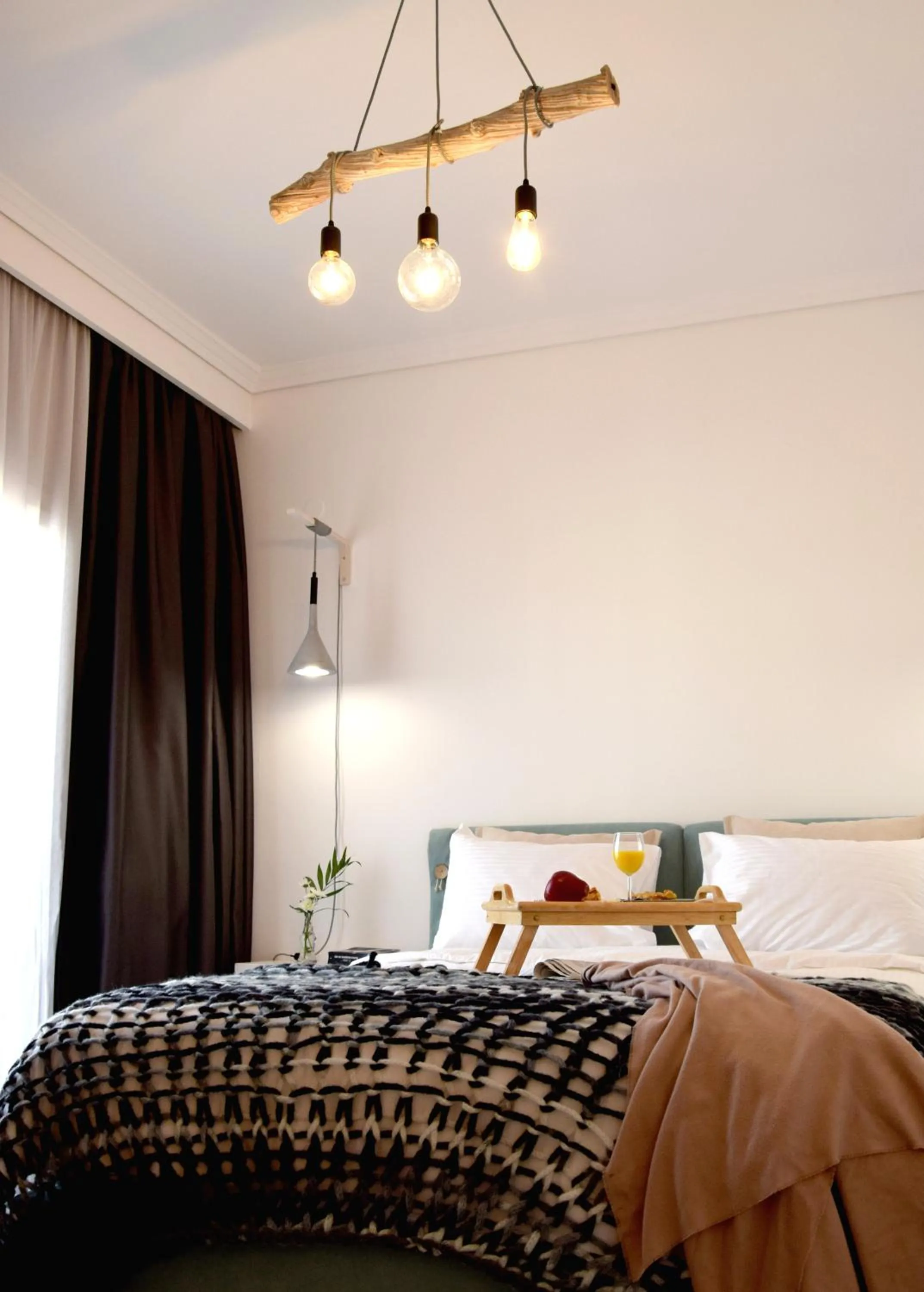 Bed in Grey Studios by Skg Apartments