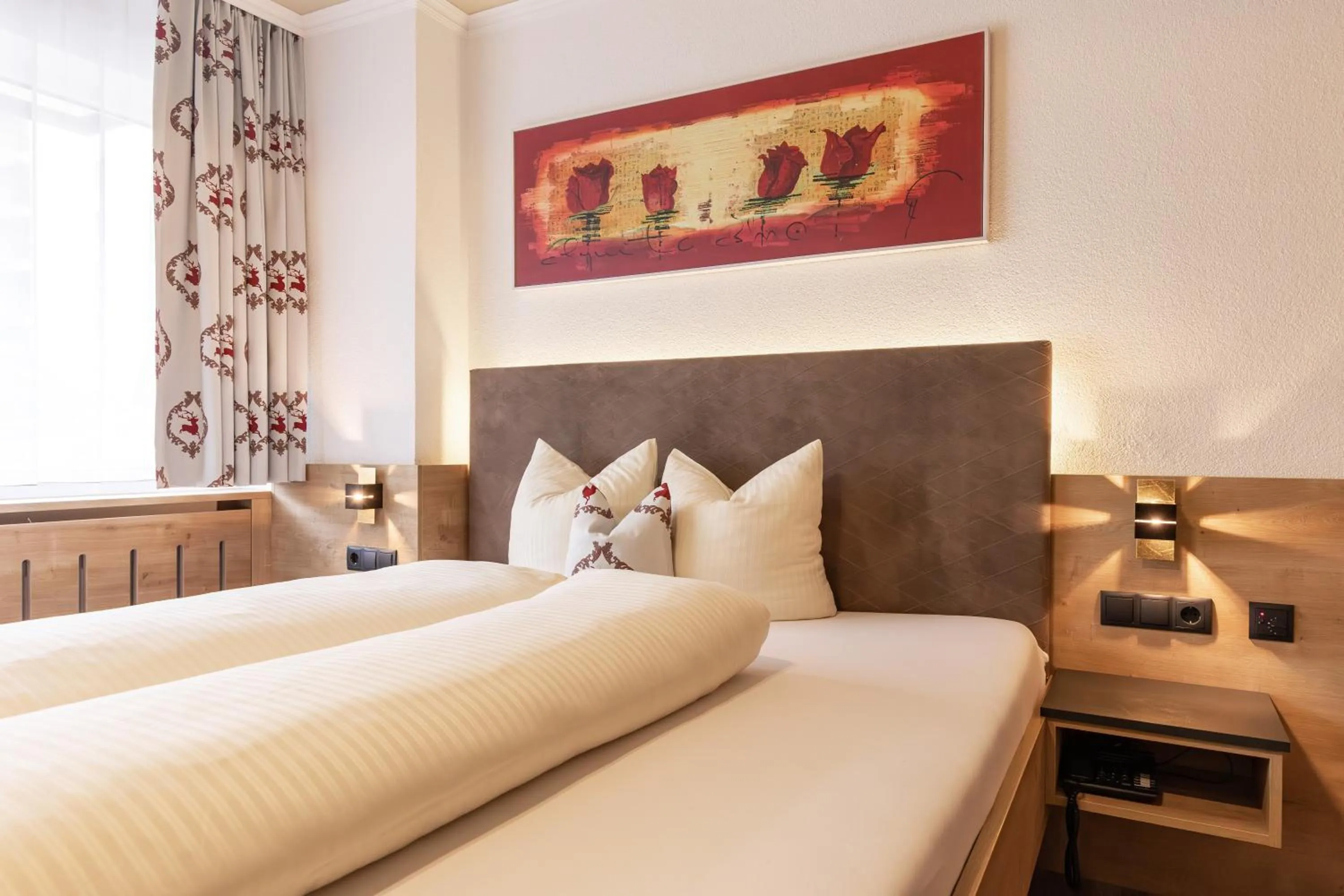 Bed in Das Aparthotel Olympia Tirol