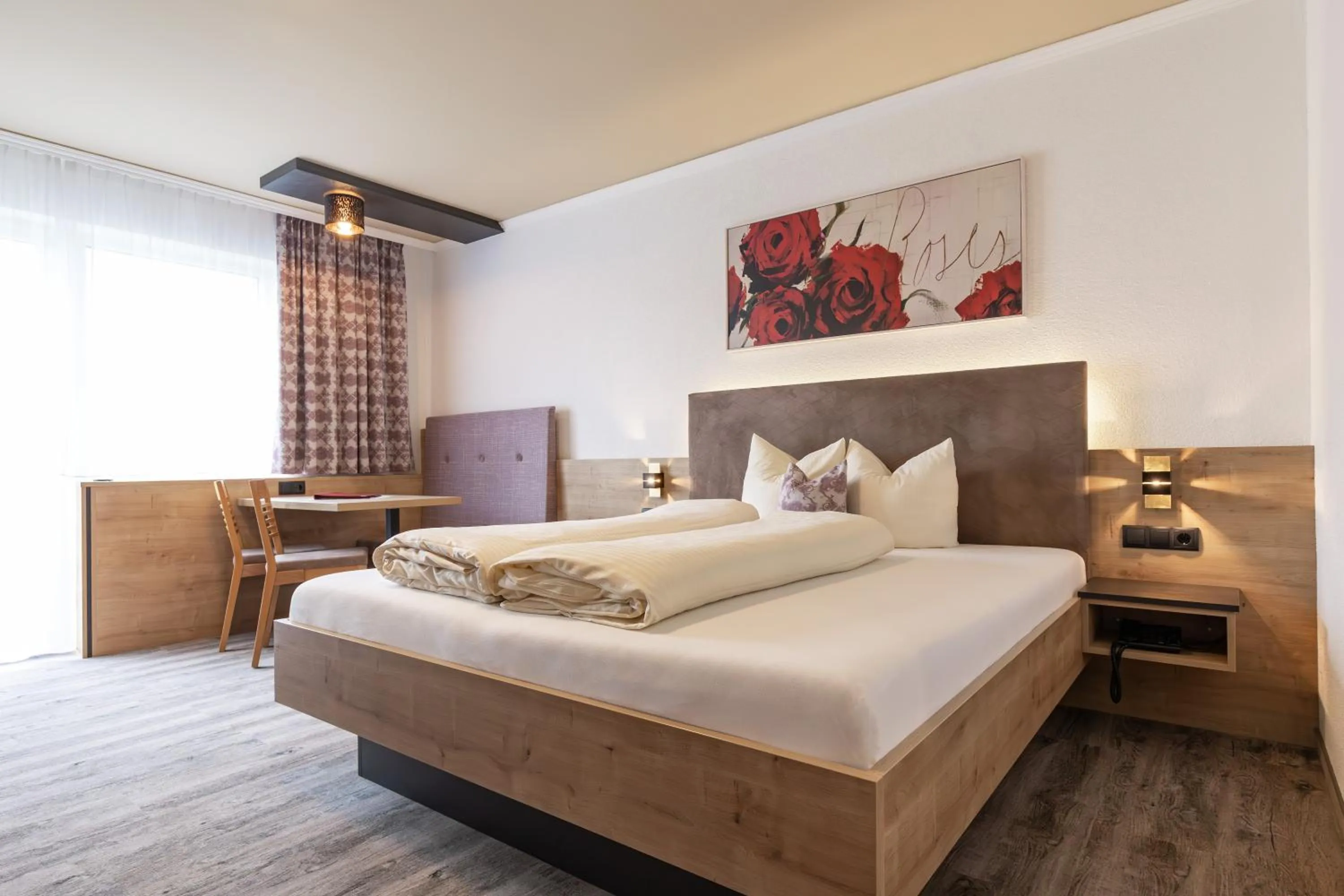 Bed in Das Aparthotel Olympia Tirol