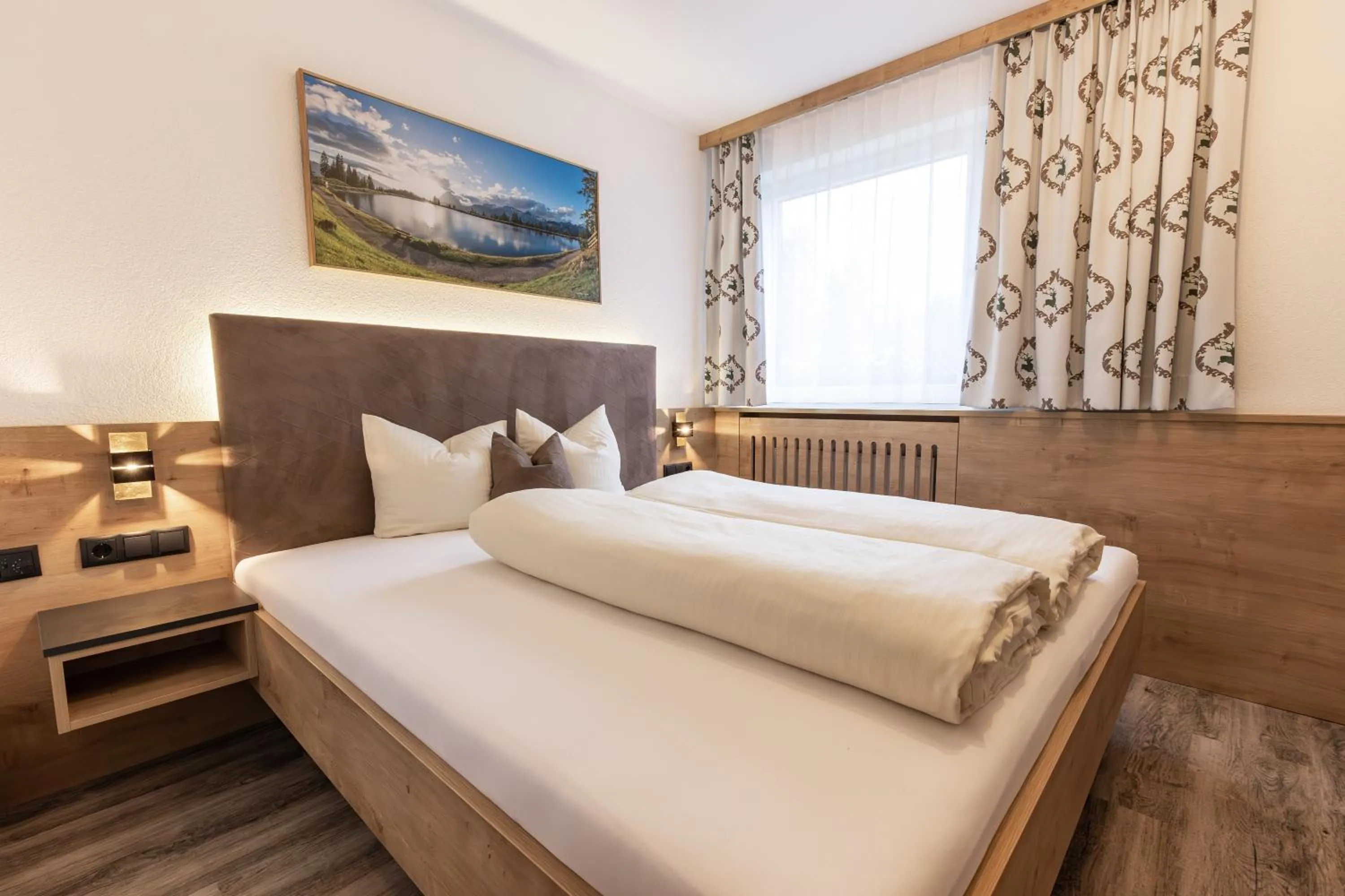Bed in Das Aparthotel Olympia Tirol