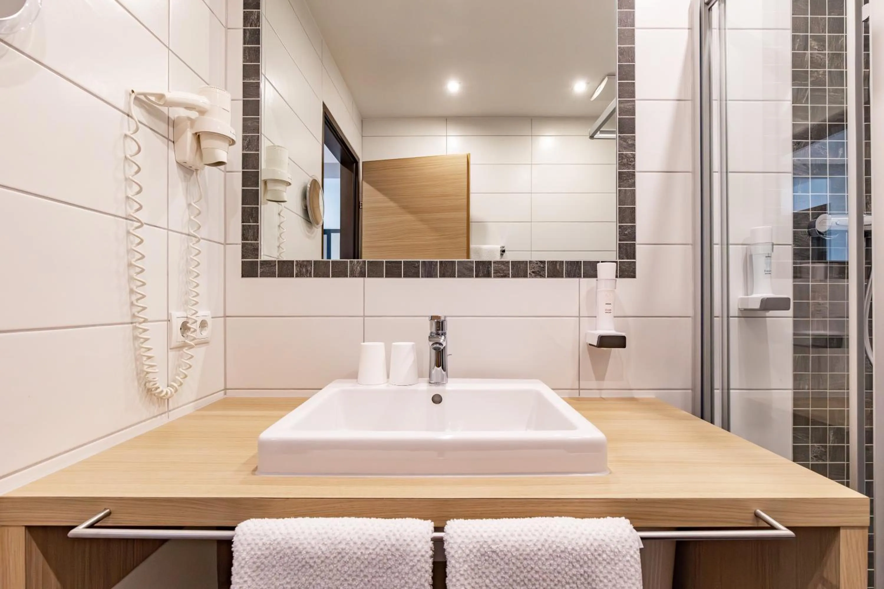 Shower in Das Aparthotel Olympia Tirol