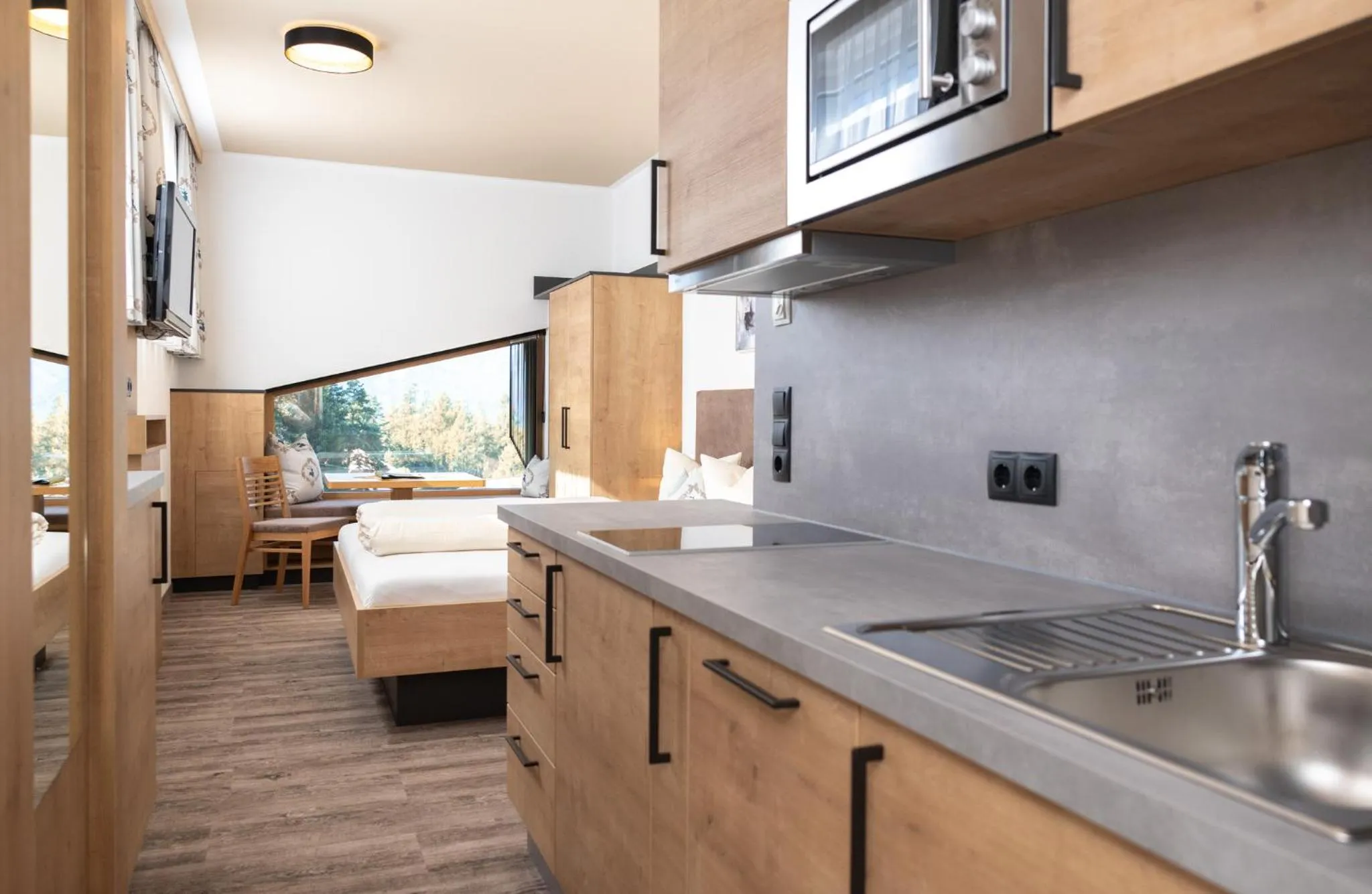 Photo of the whole room, Bed in Das Aparthotel Olympia Tirol