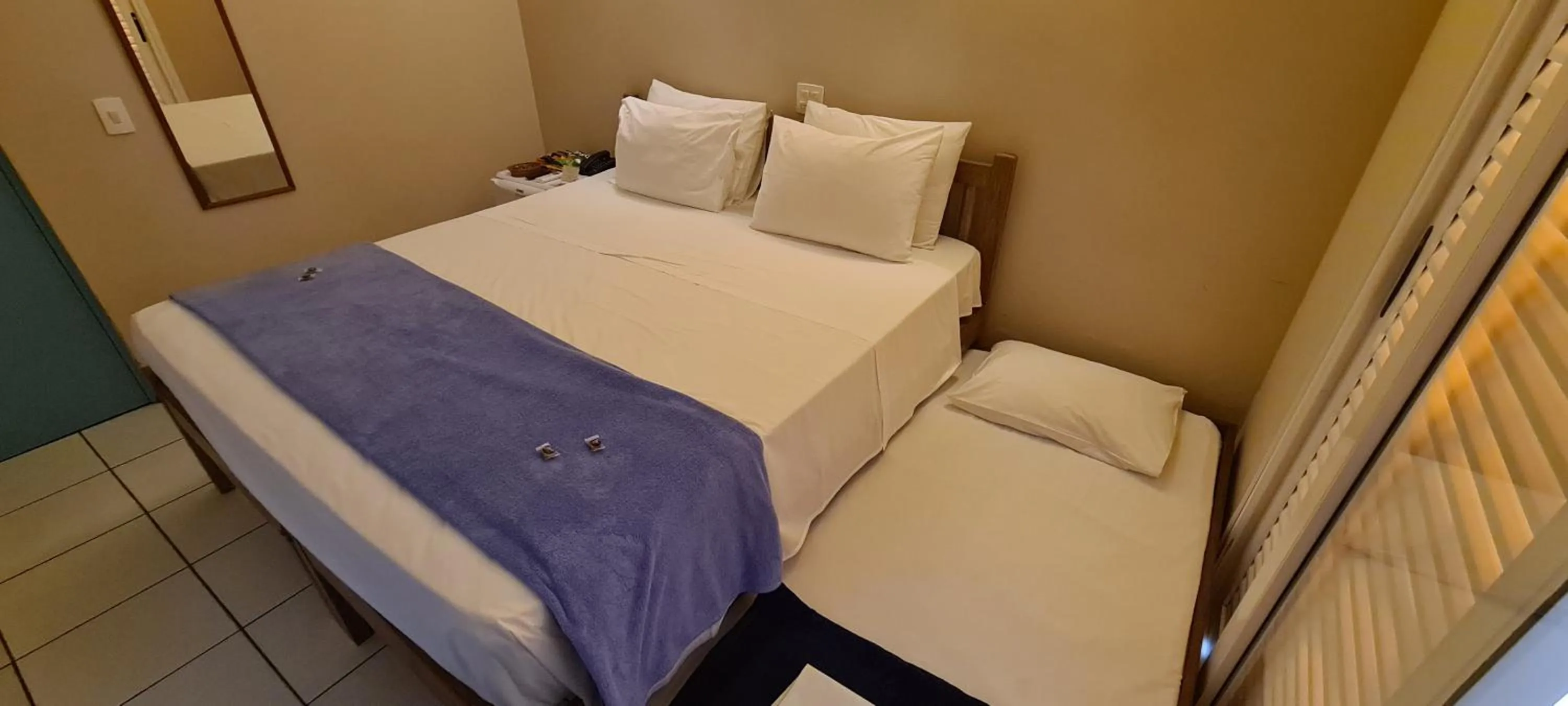 Bed in Pousada Toca da Praia