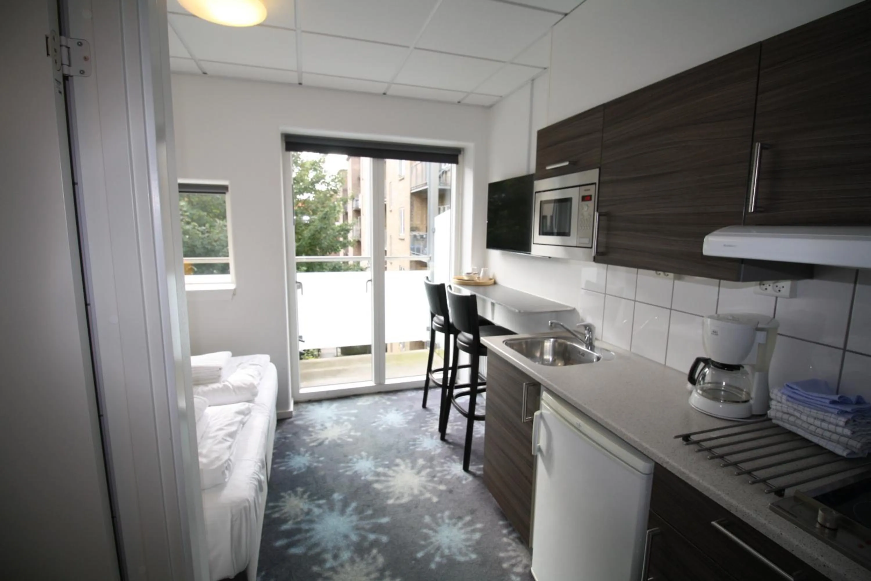 Kitchen or kitchenette in ApartHotel Faber