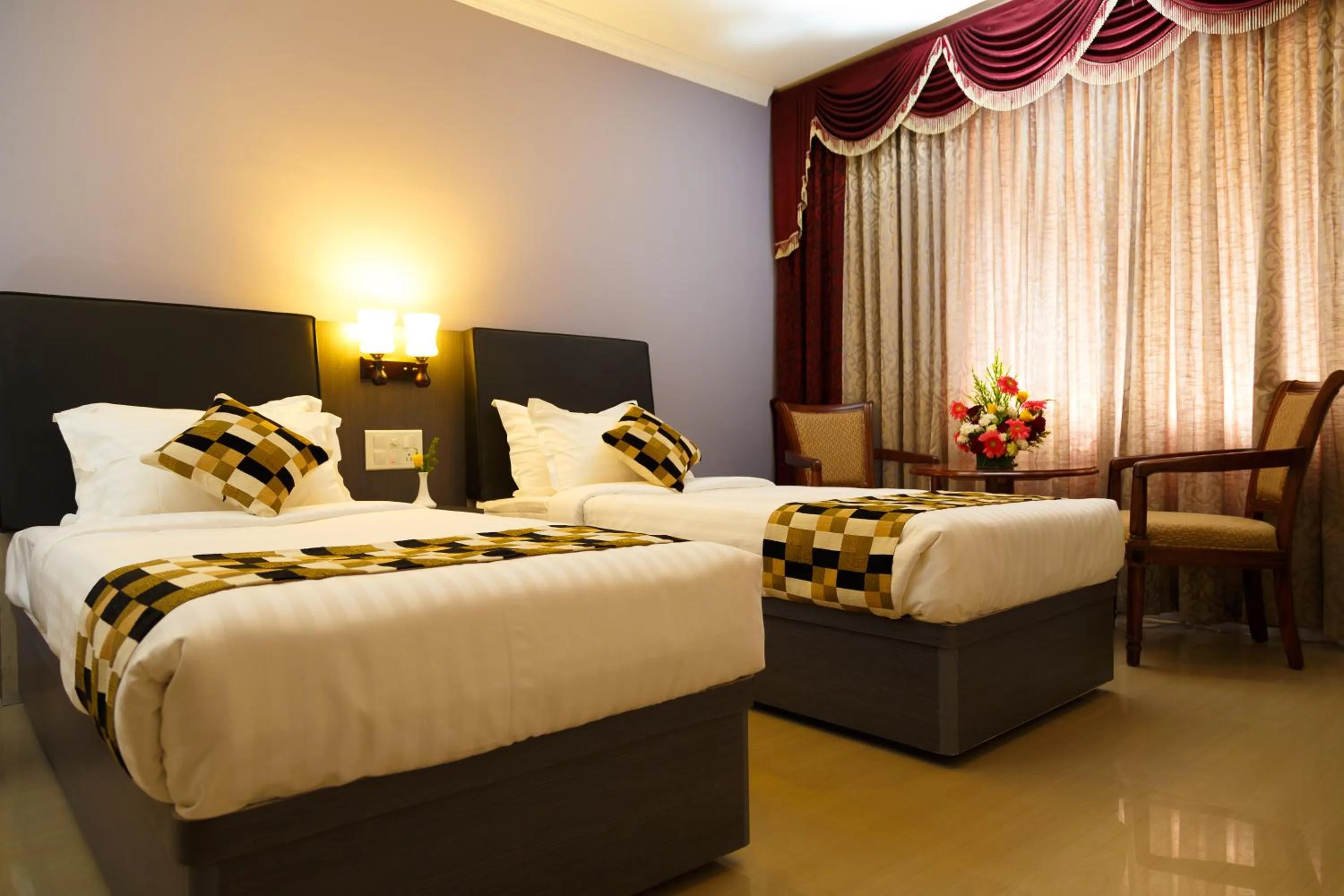 Bed in Hotel Gopalapuram International