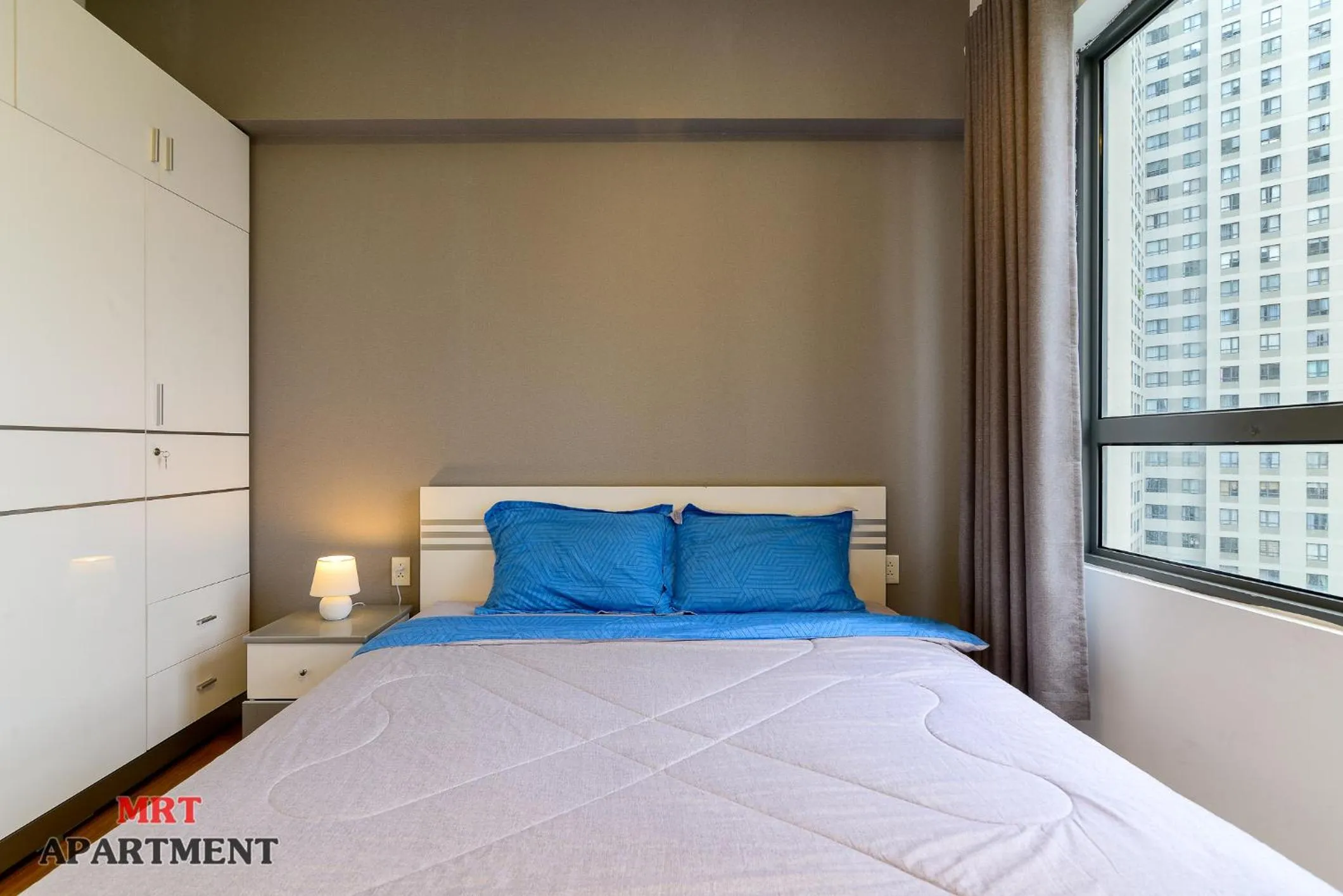 Bed in MRT Apartment In Masteri Thao Dien