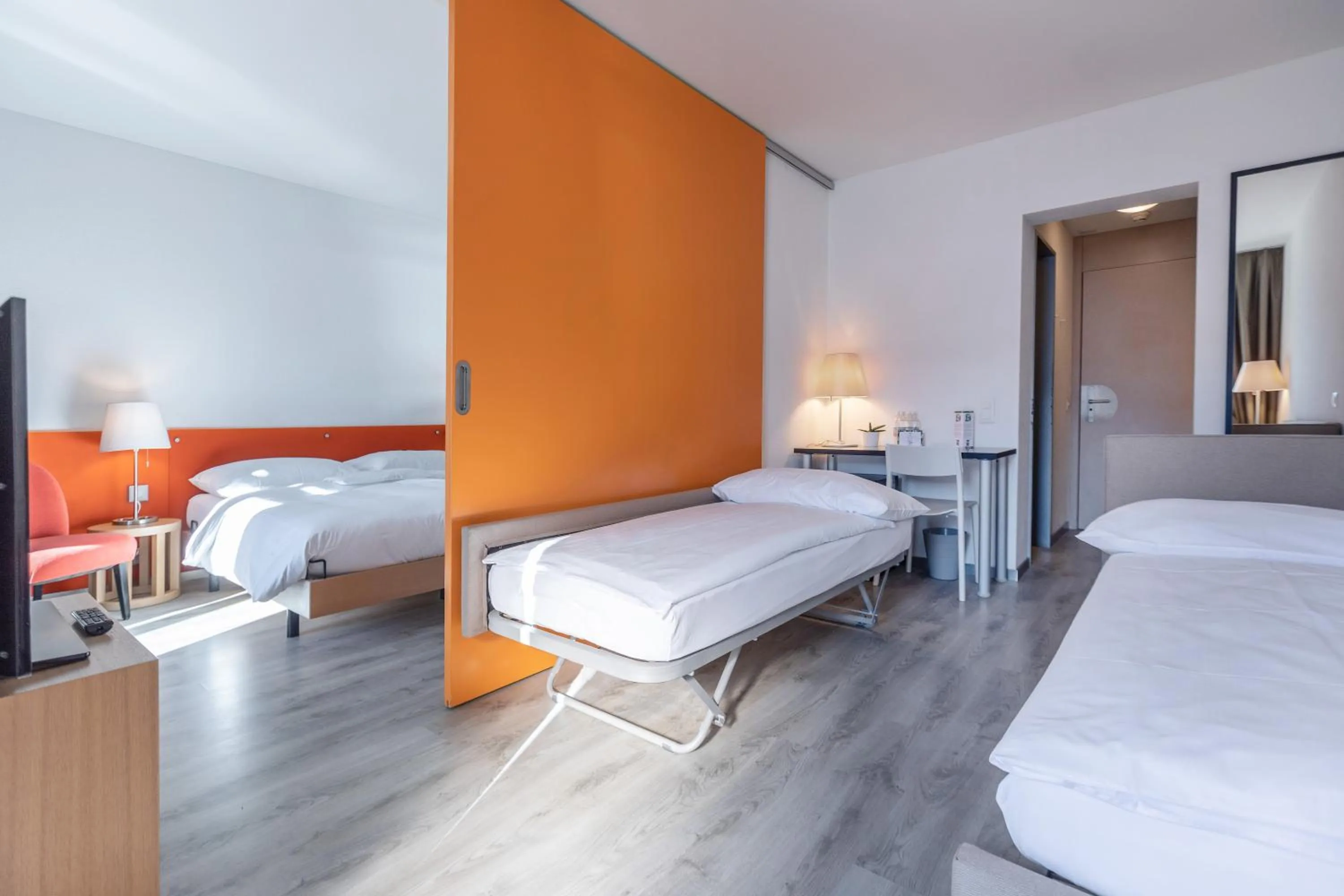 Photo of the whole room, Bed in Parkhotel Brenscino Brissago