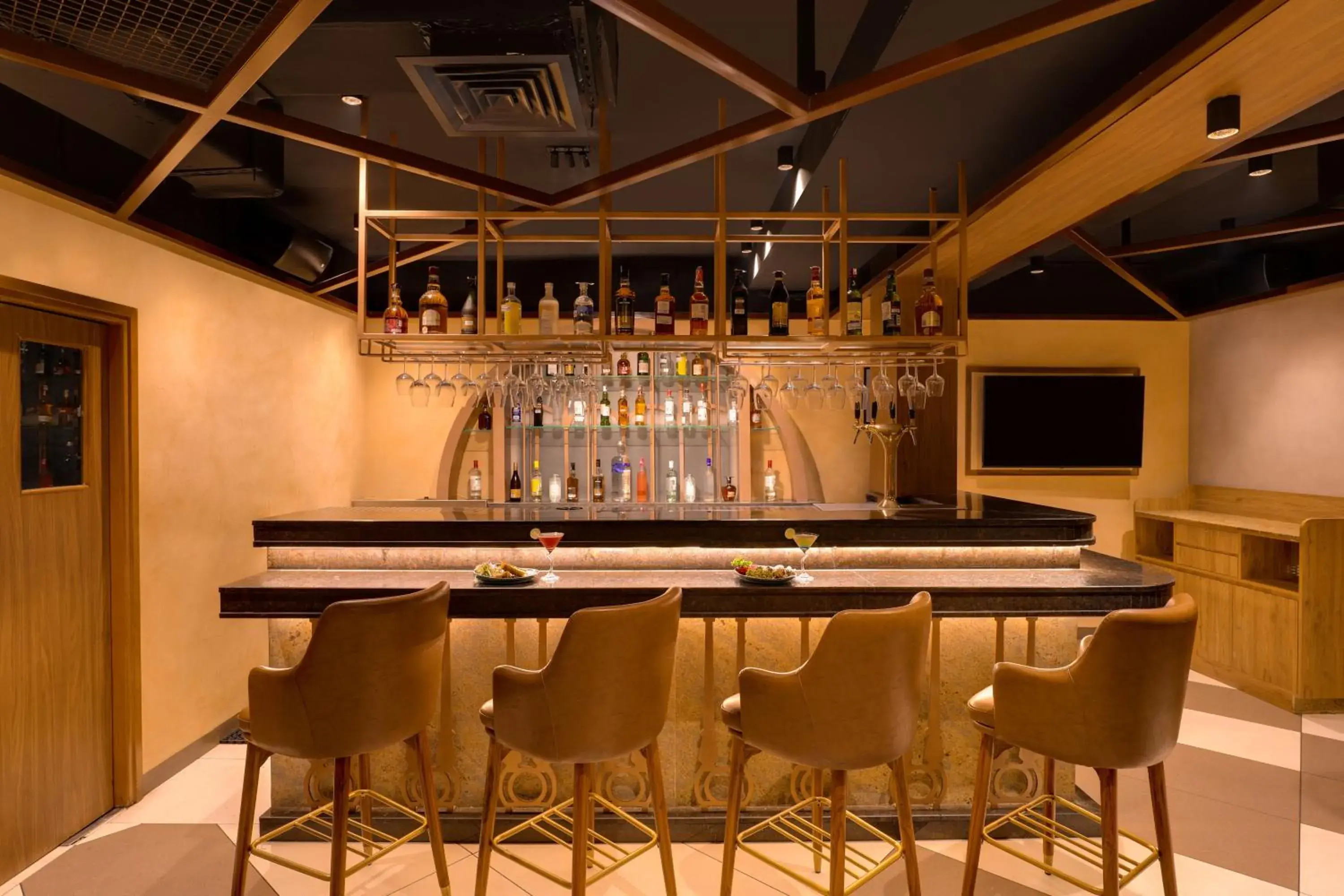 Lounge or bar in Keys Prima by Lemon Tree Hotels, Katti-Ma, Chennai Lounge or bar in Keys Prima by Lemon Tree Hotels, Katti-Ma, Chennai
