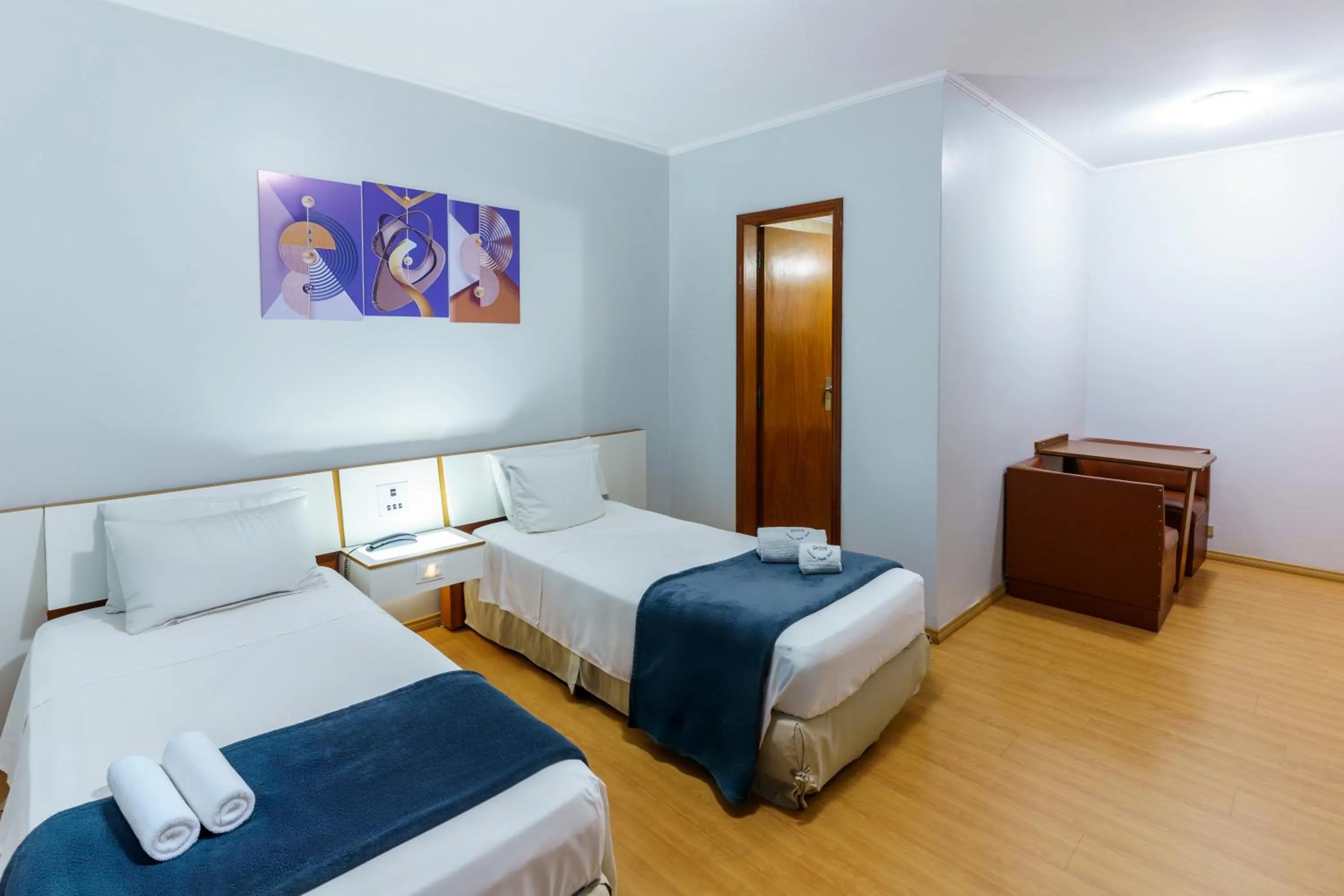 Bed in Carillon Plaza Hotel