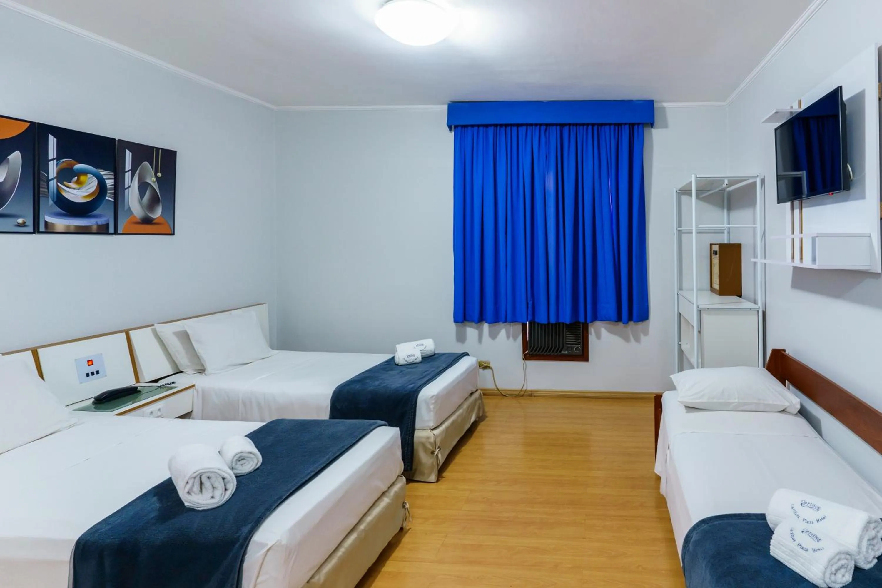 Bed in Carillon Plaza Hotel