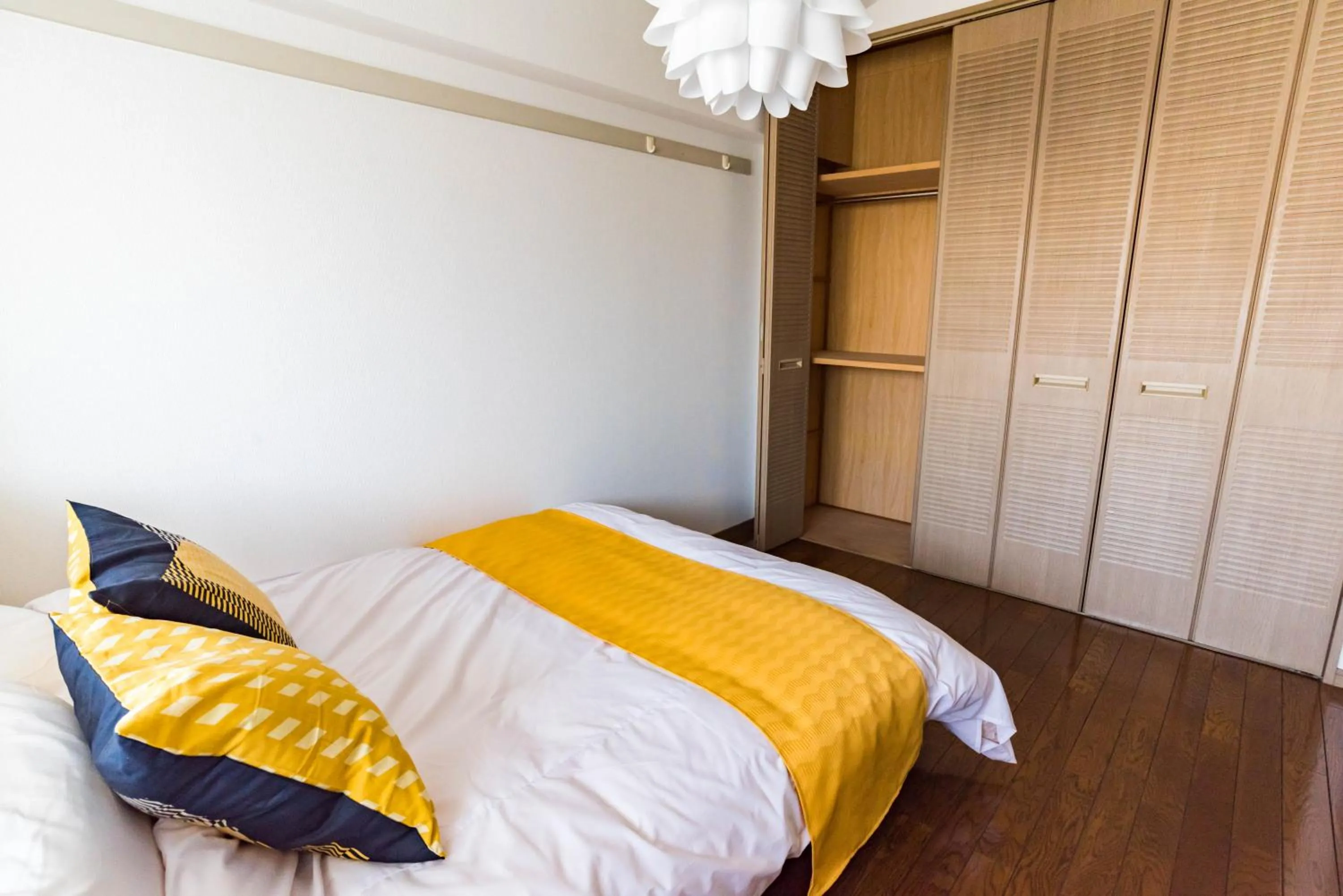 Bed in Universal Bay Condominium