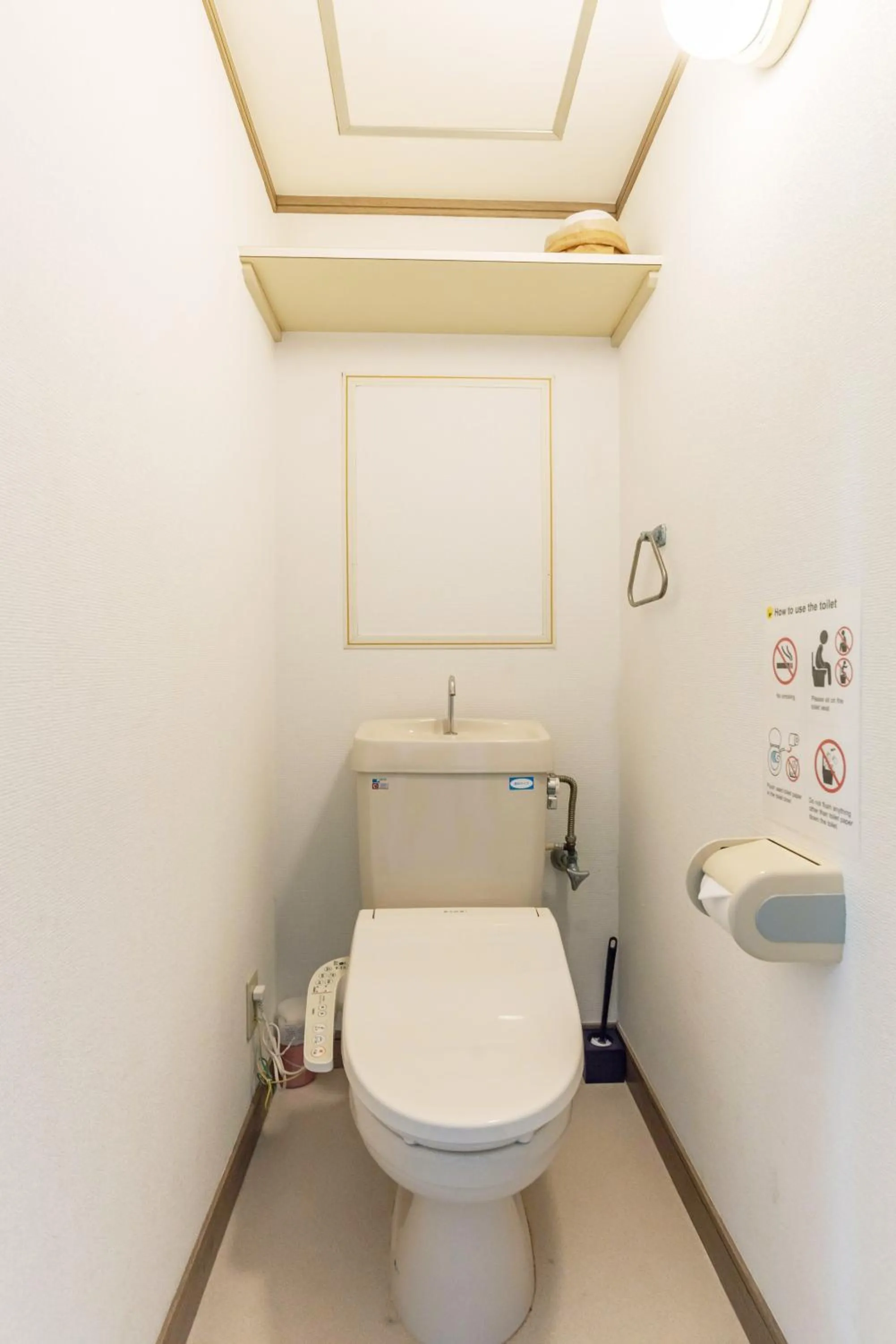 Toilet in Universal Bay Condominium