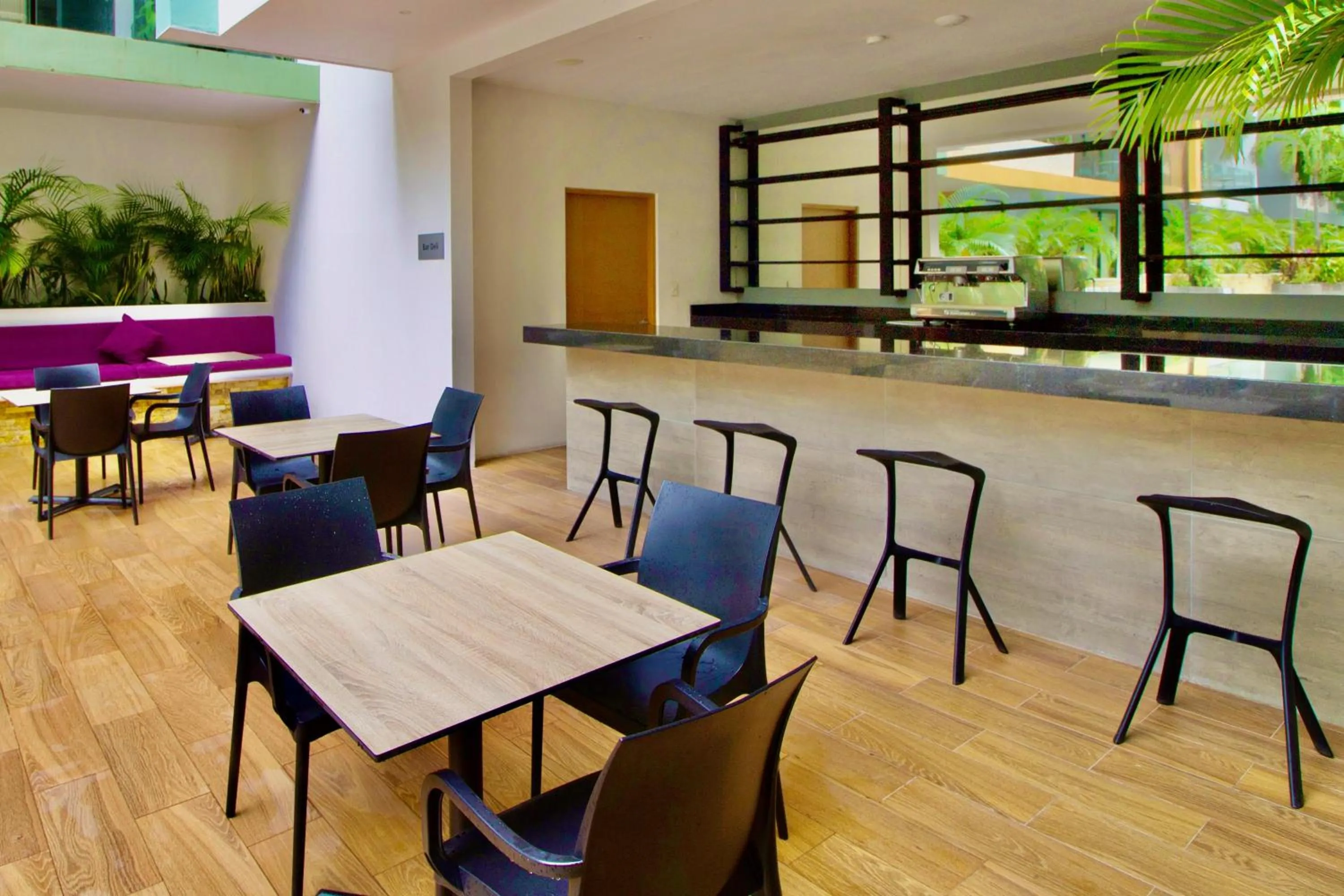 Seating area in Menesse the City by Casago