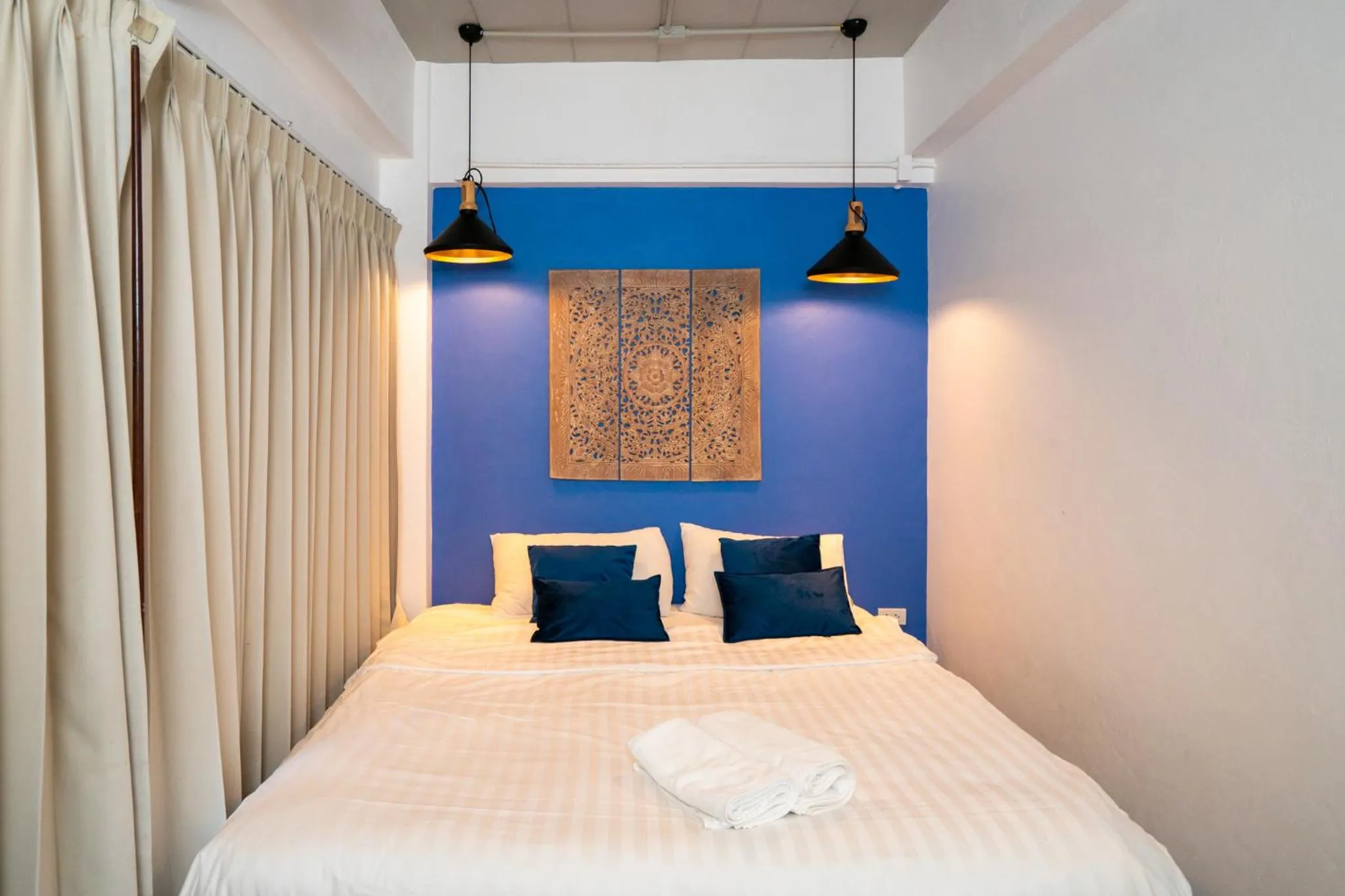 Bed in The Panwa Guesthouse, Phuket