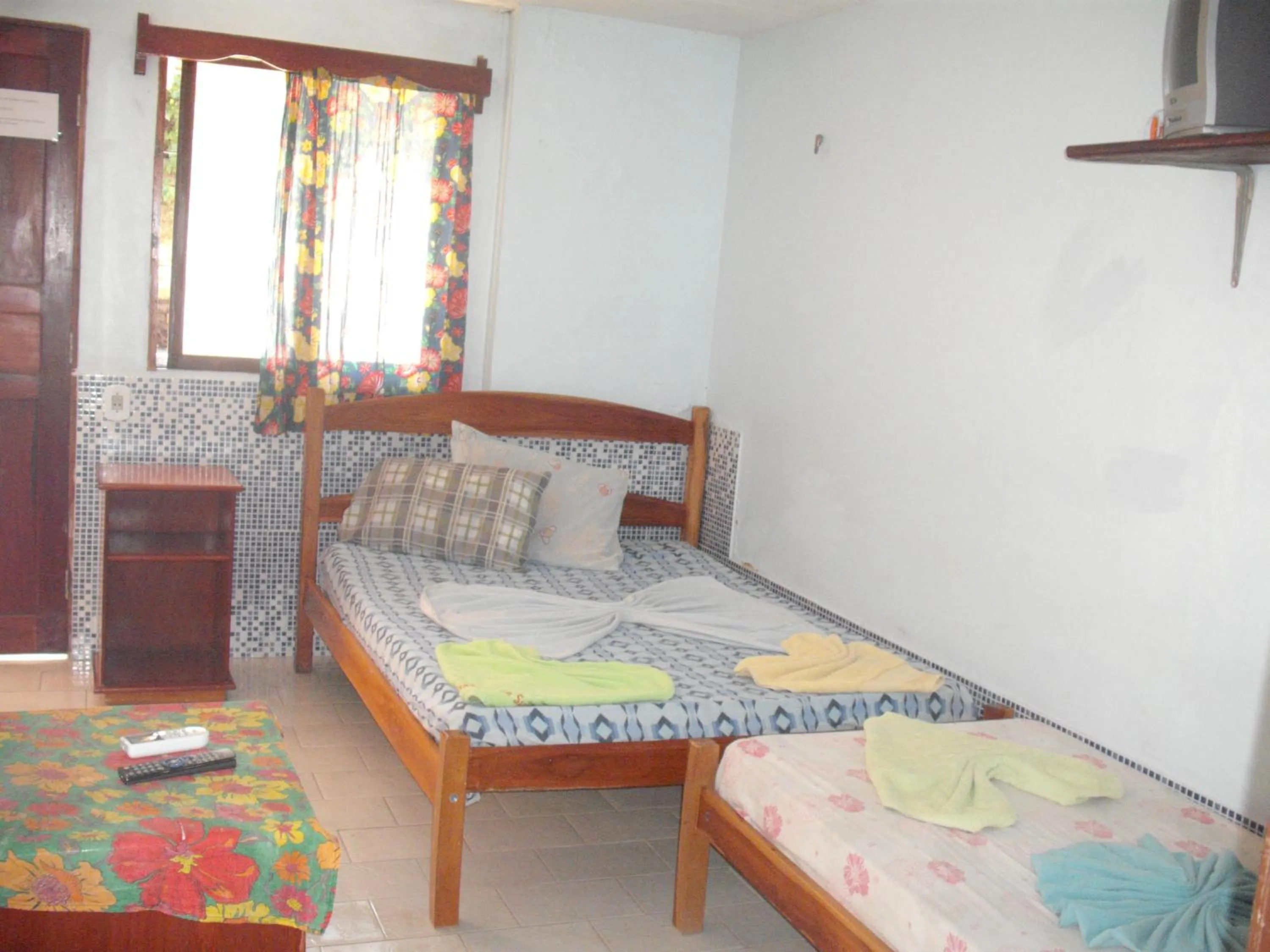 Bed in Pousada Chalé Suiço