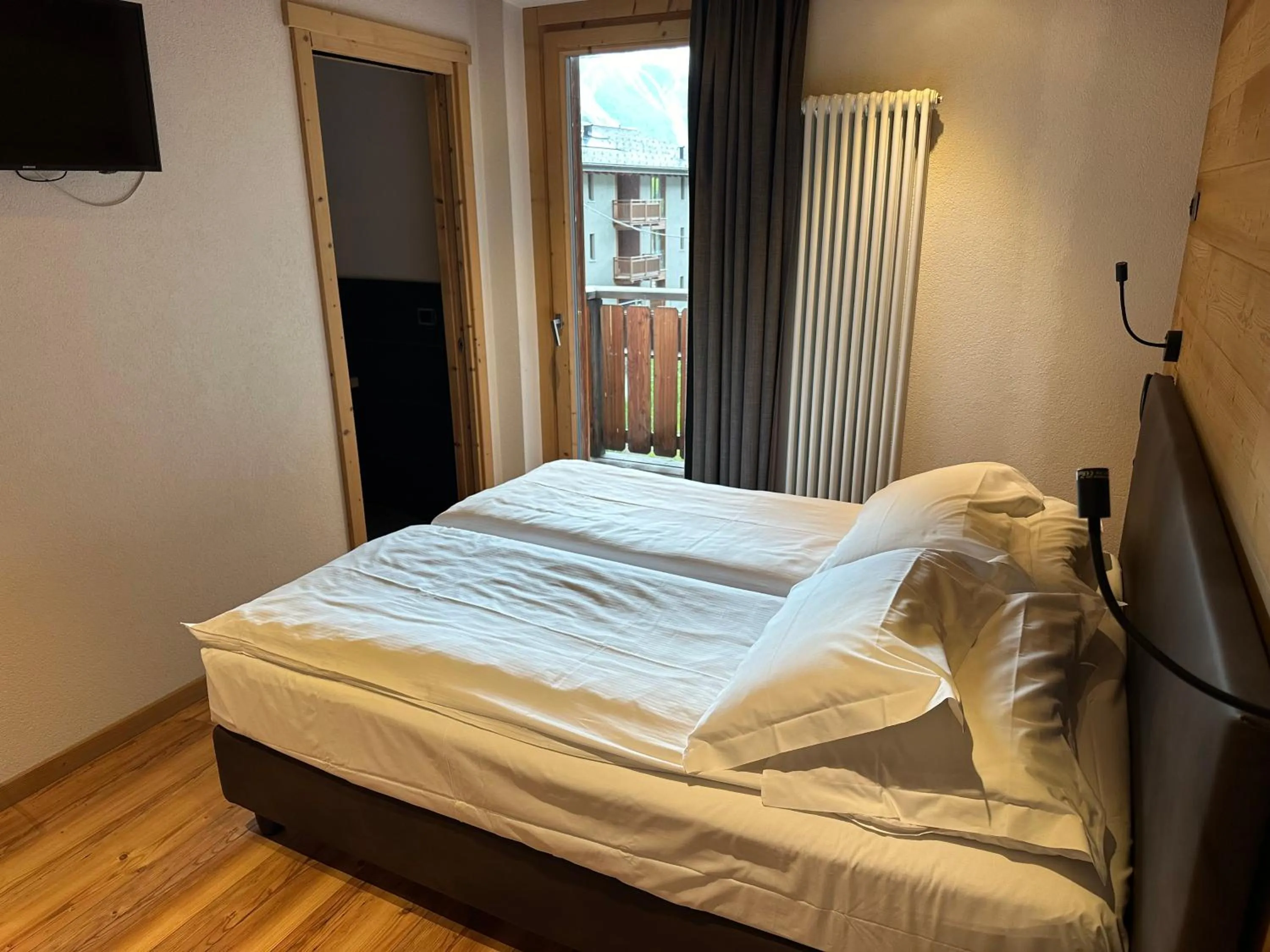 Photo of the whole room, Bed in Alpen Hotel Chalet