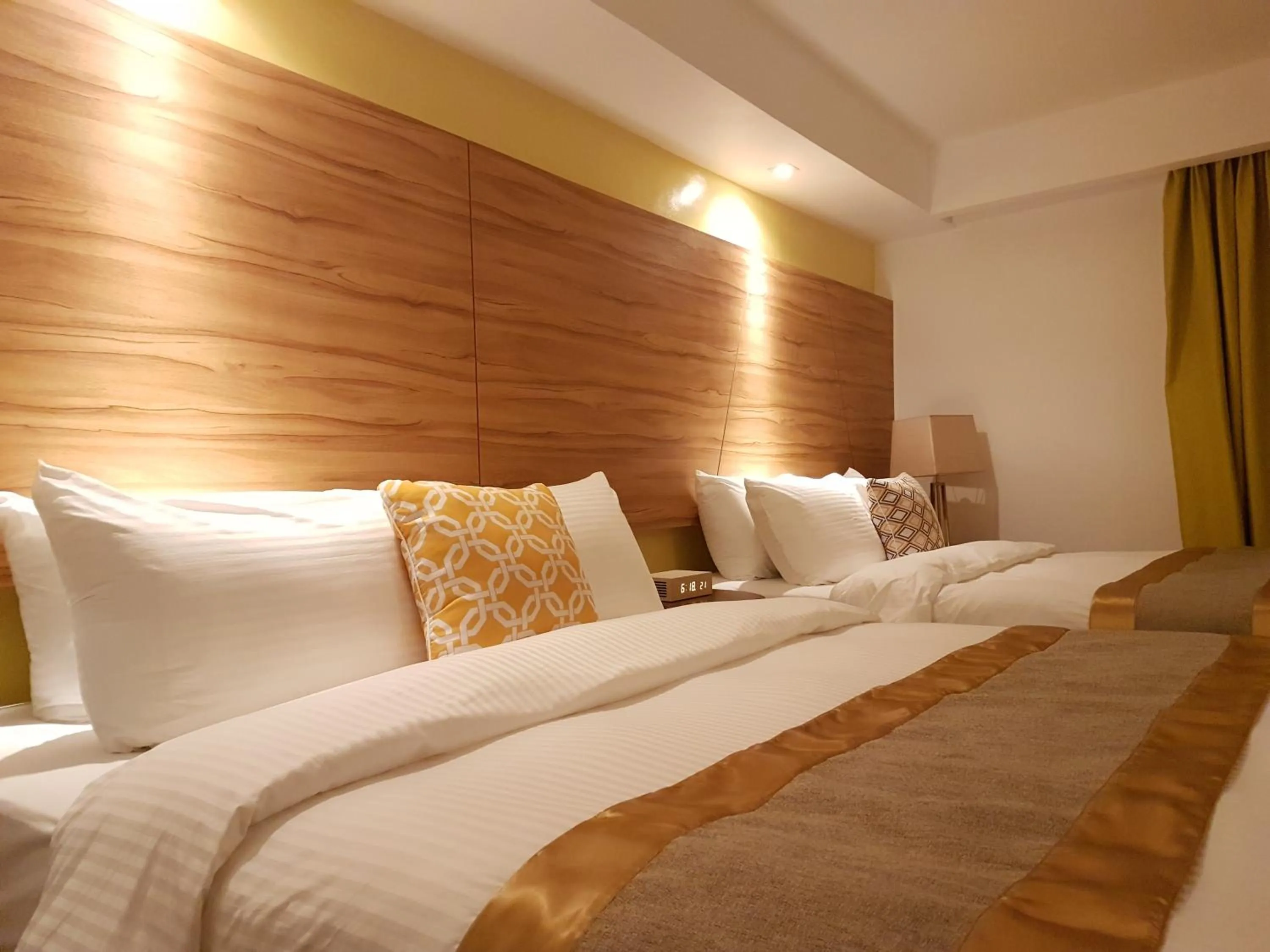 Bed in Ferra Hotel and Garden Suites