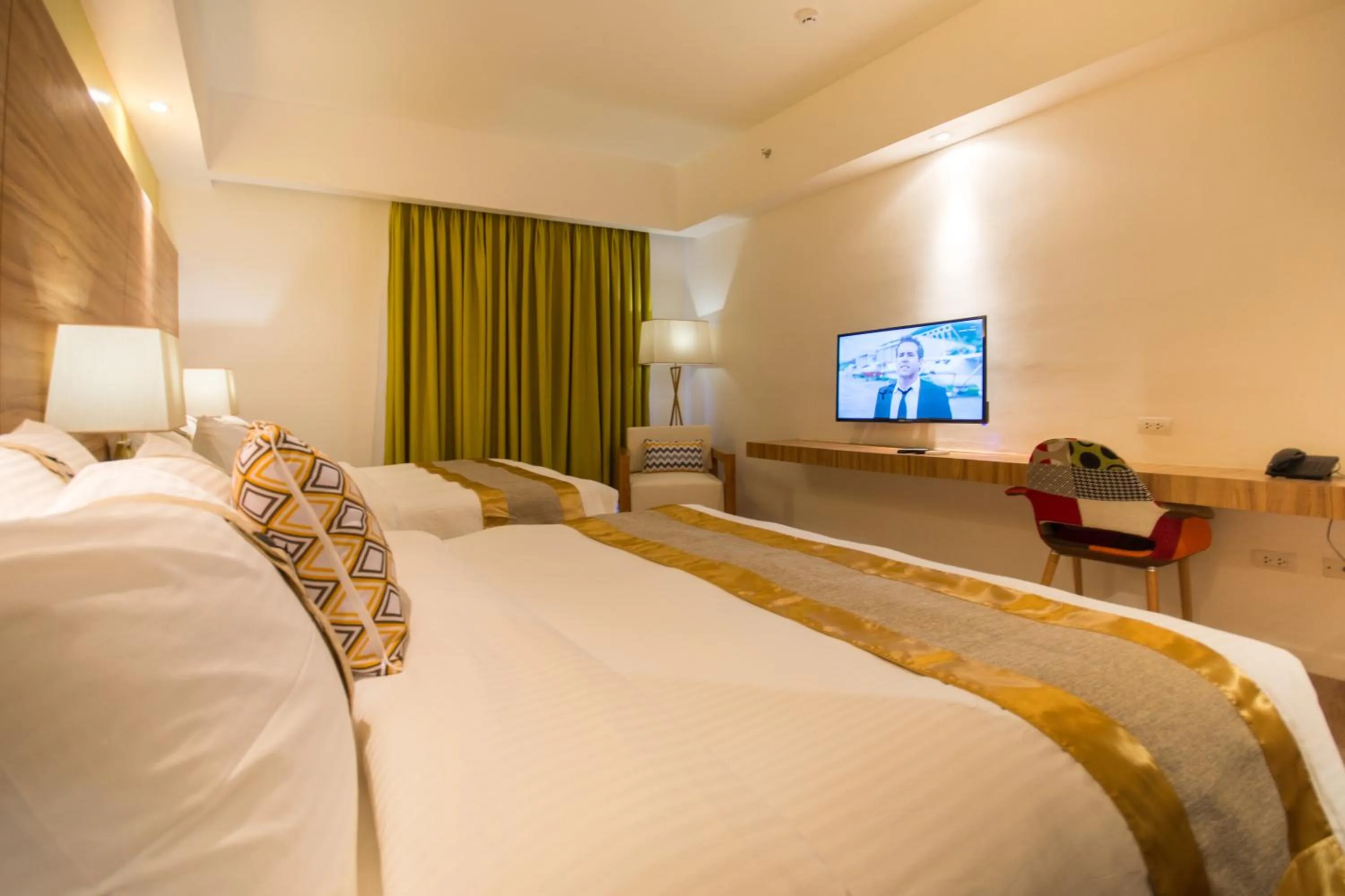 Bed in Ferra Hotel and Garden Suites