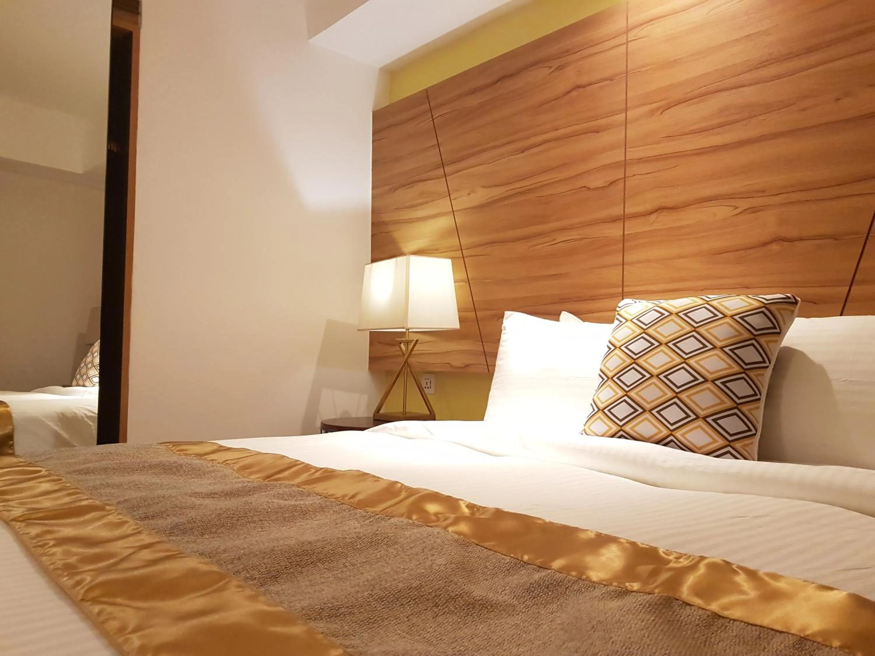 Bed in Ferra Hotel and Garden Suites