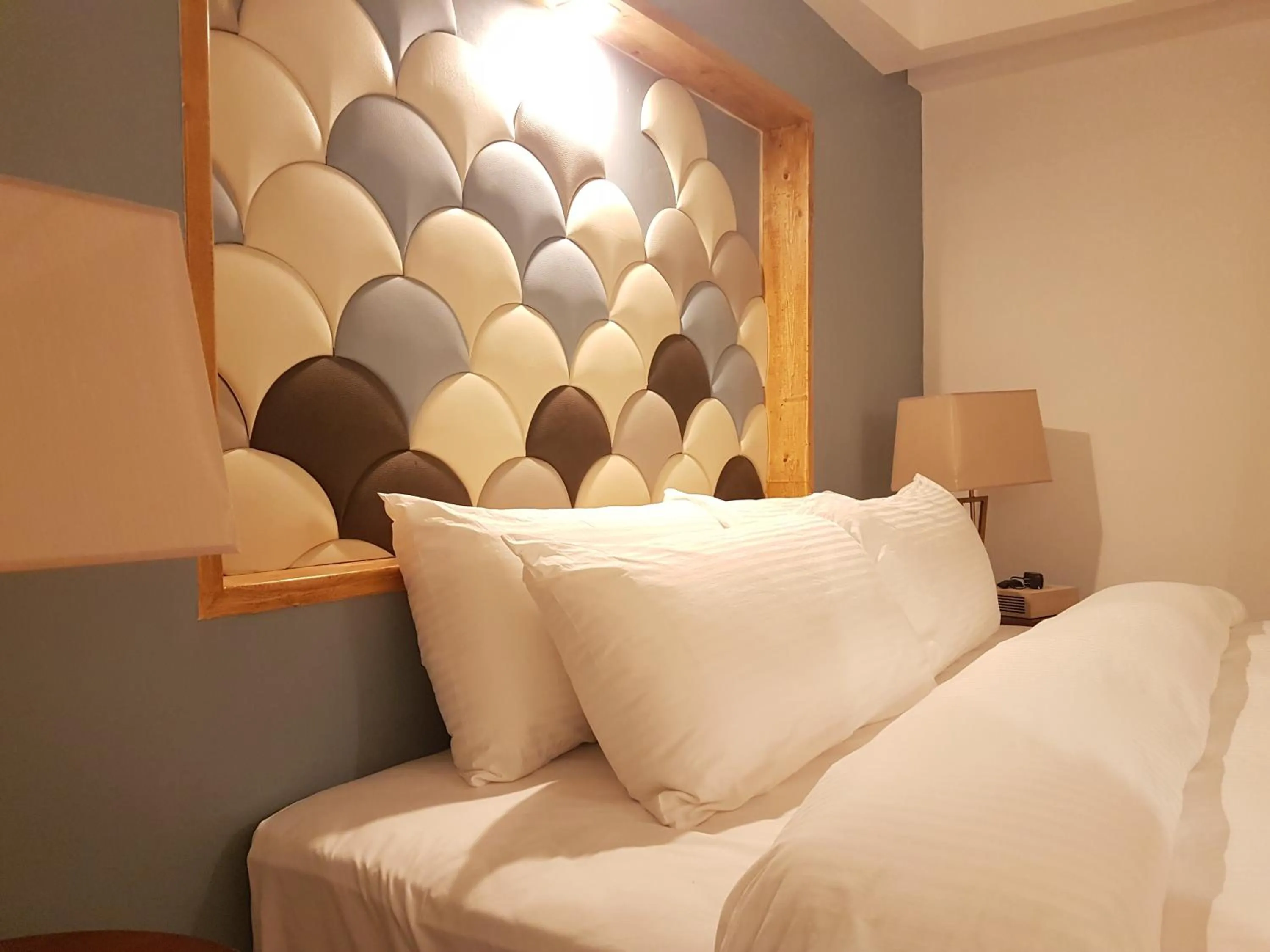 Bed in Ferra Hotel and Garden Suites