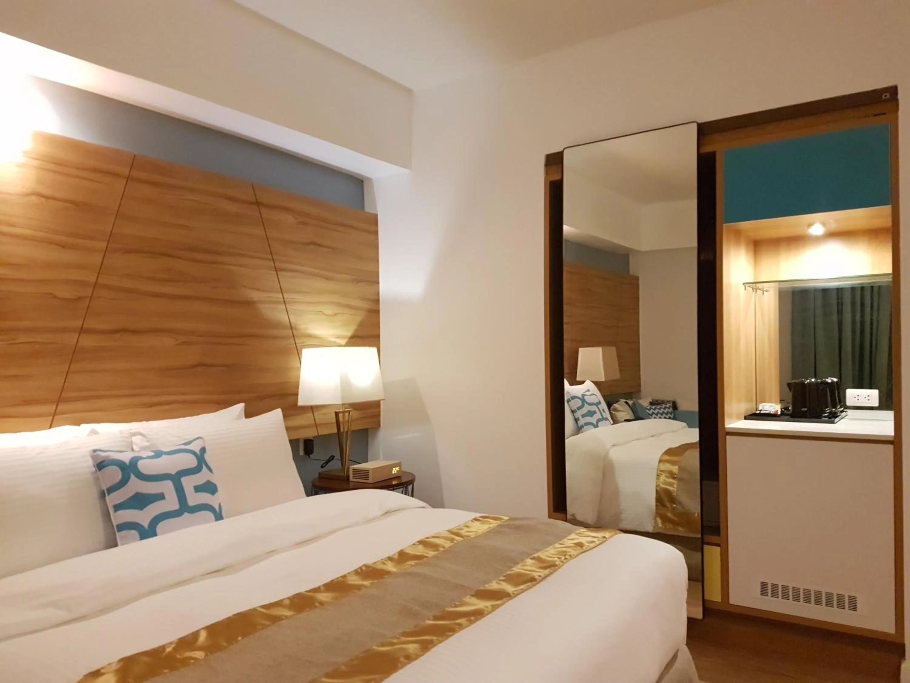 Bed in Ferra Hotel and Garden Suites