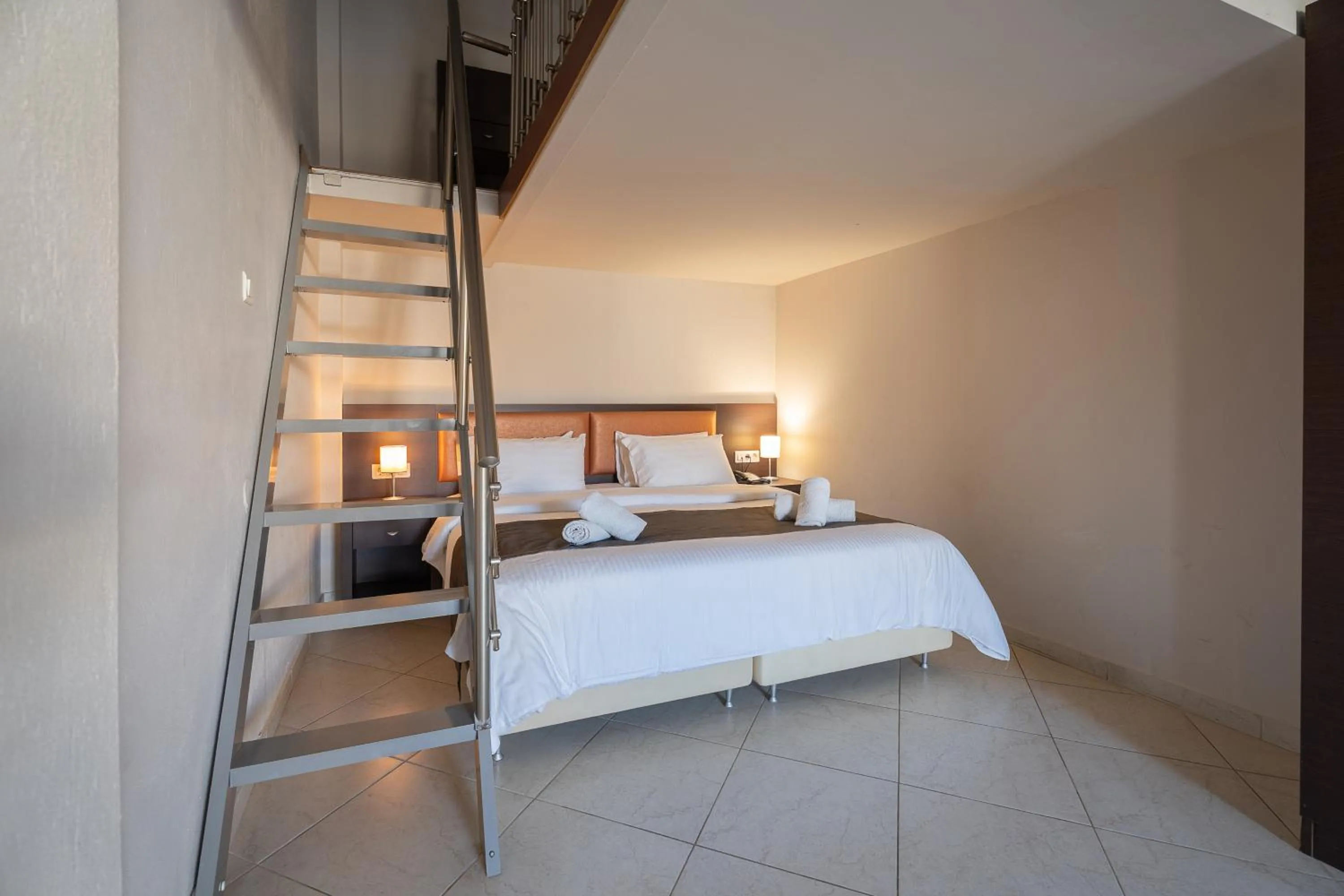 Bed in Meliton Inn Hotel & Suites by the beach