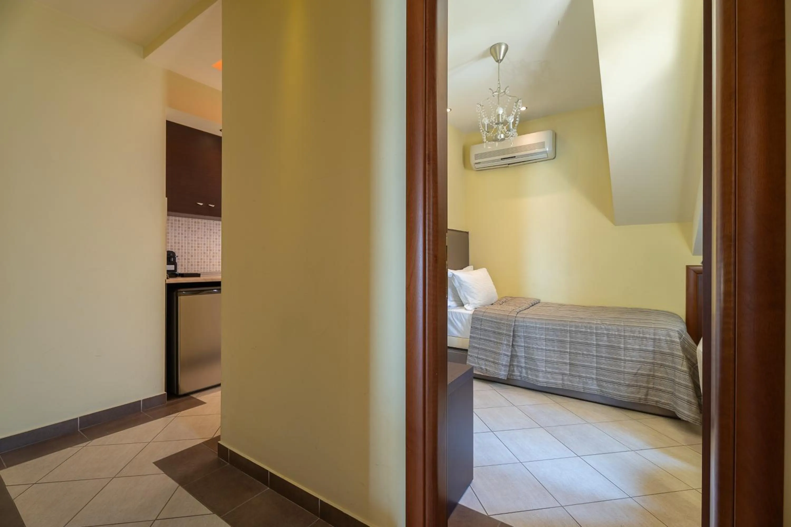 Bed in Meliton Inn Hotel & Suites by the beach