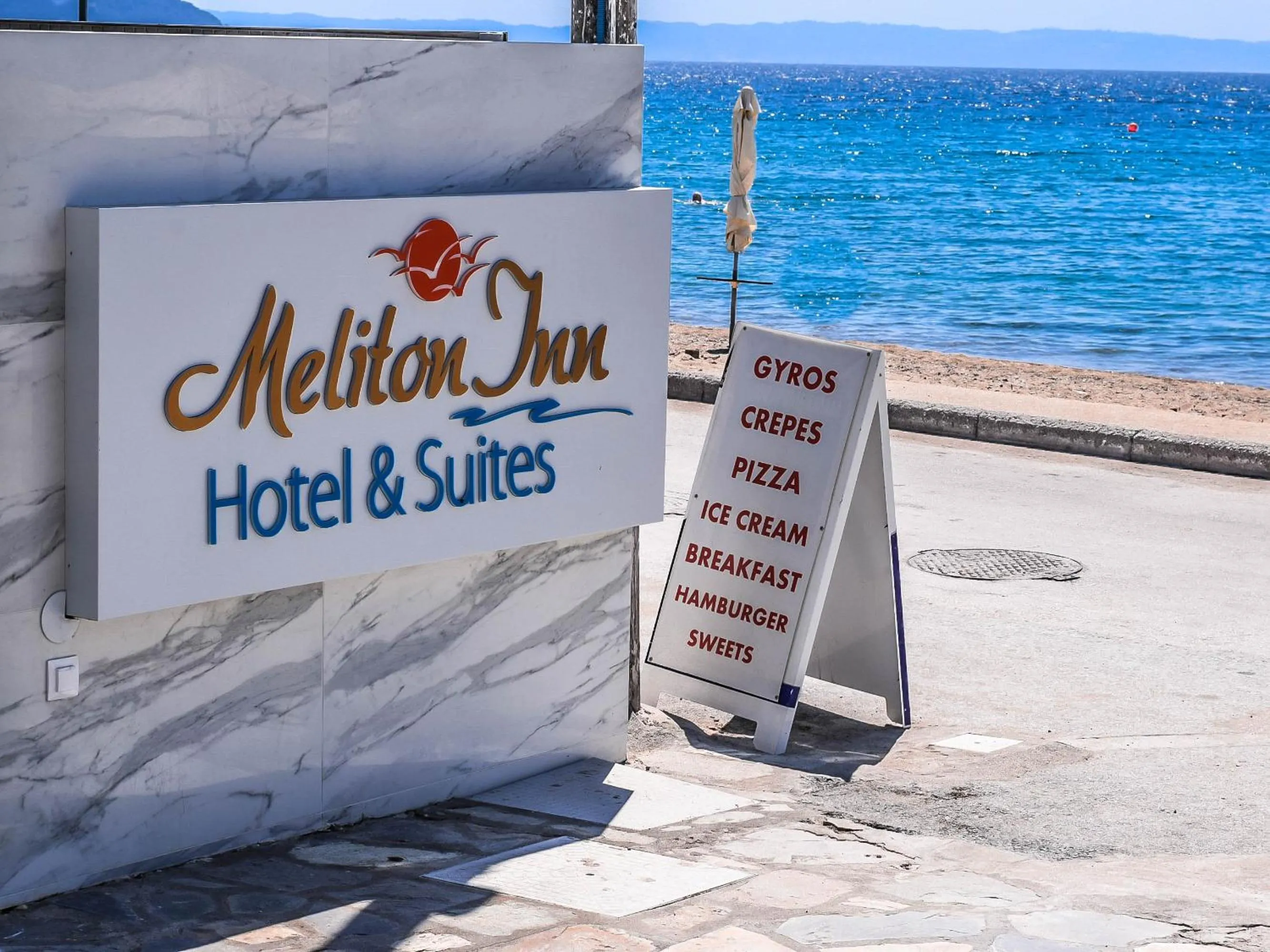 Logo/Certificate/Sign in Meliton Inn Hotel & Suites by the beach