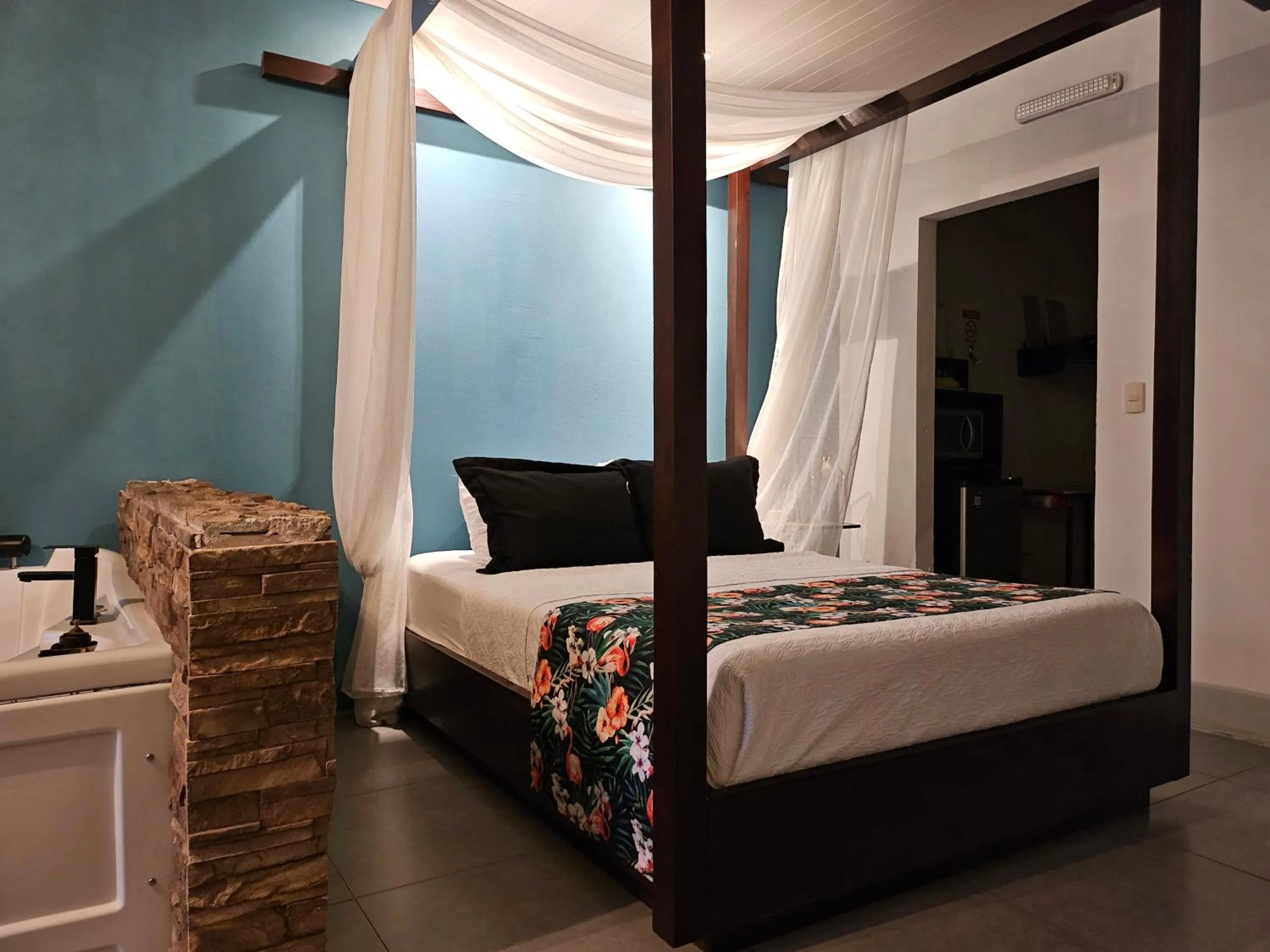 Bed in Yellow Tree Suites