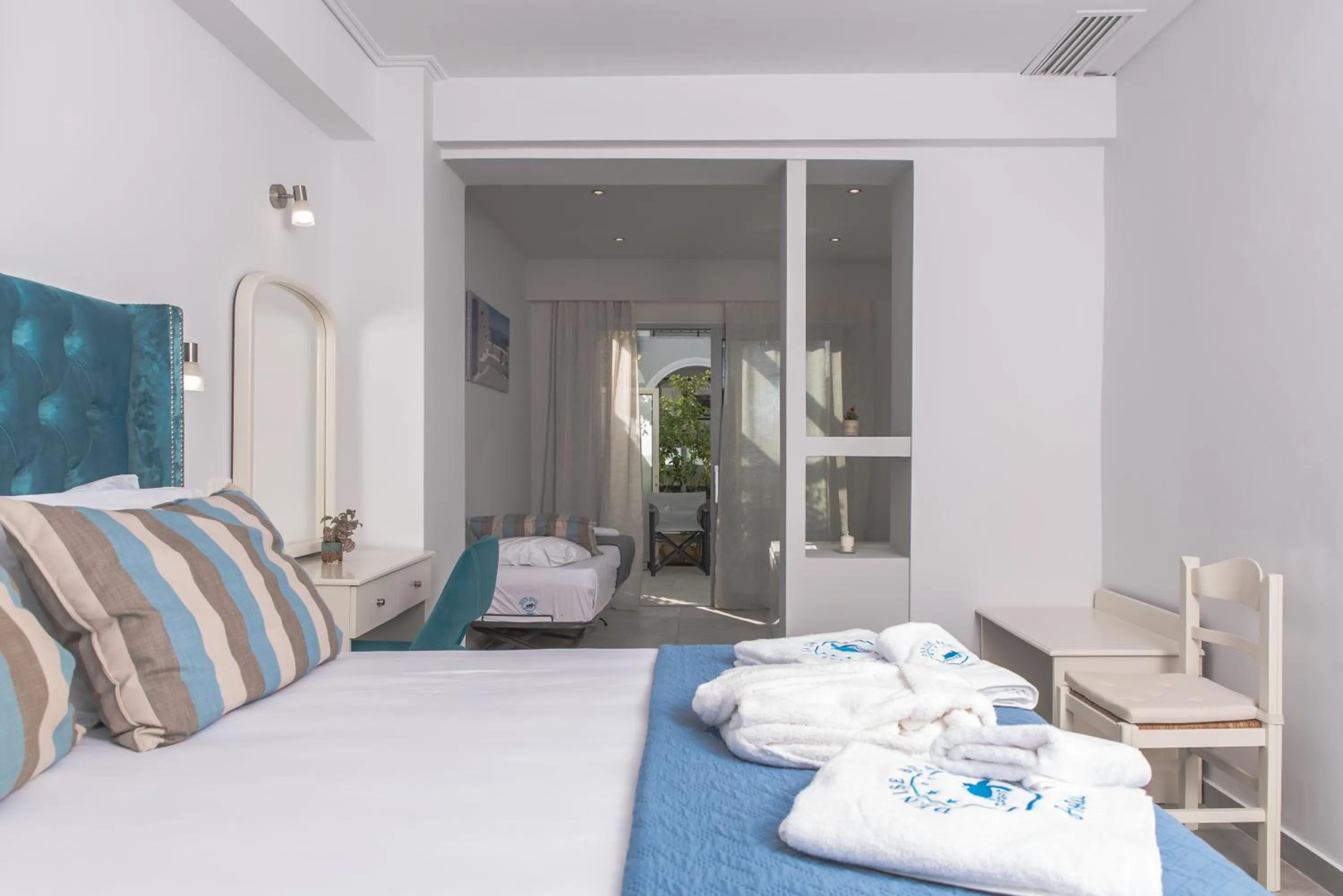 Bed in Denise Beach Hotel