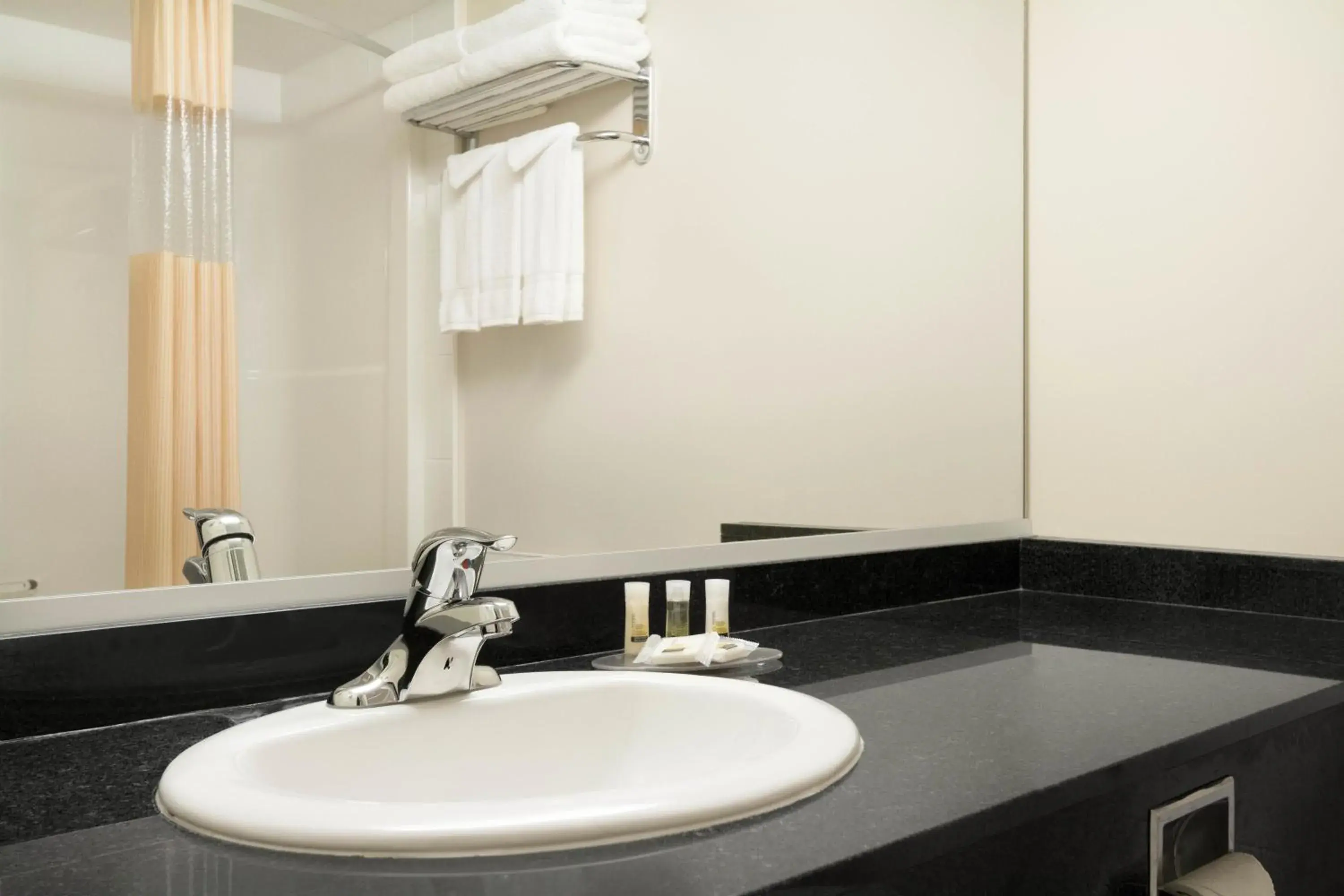 Bathroom in Days Inn & Suites by Wyndham Langley Bathroom in Days Inn & Suites by Wyndham Langley