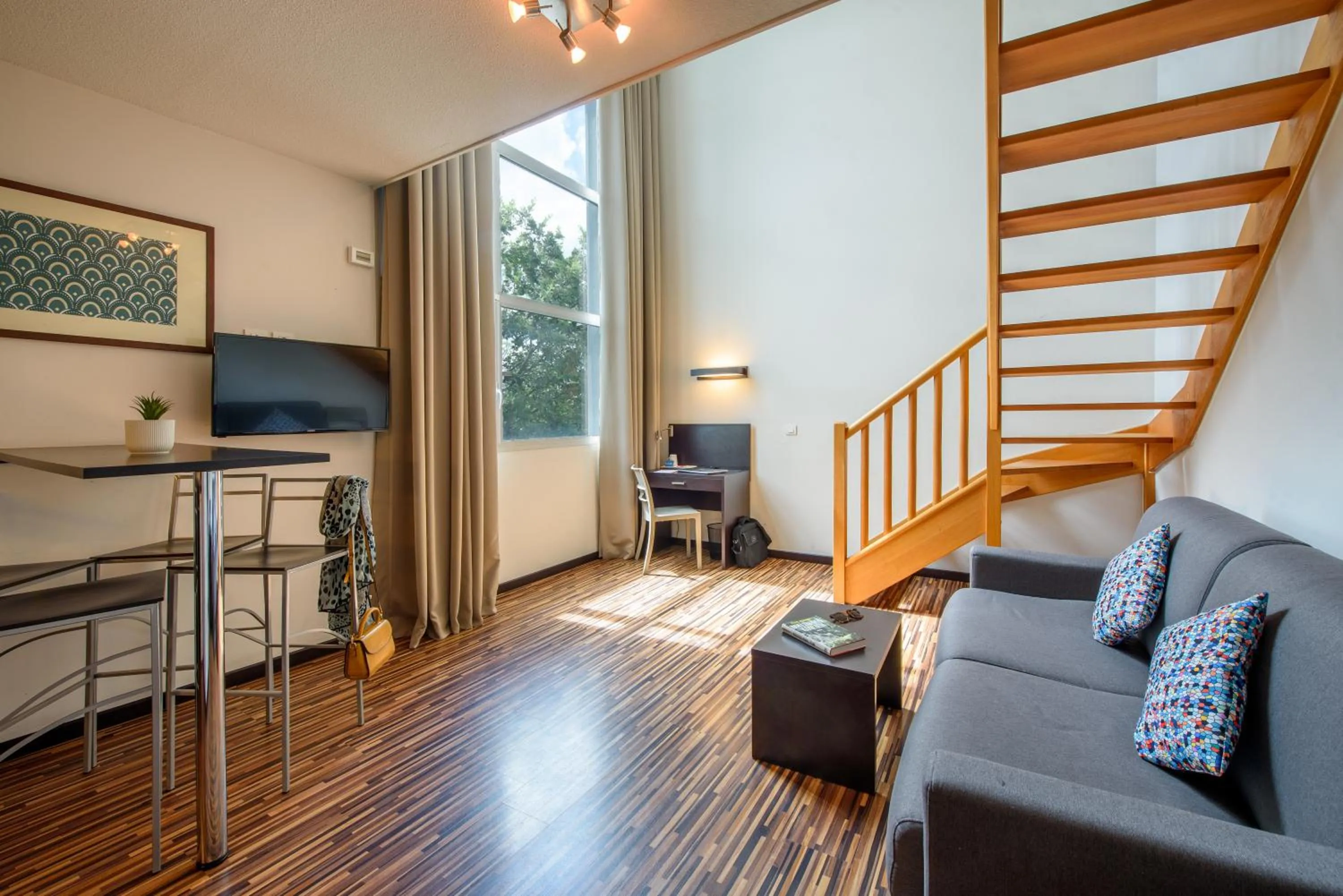 Photo of the whole room in Clarion Aparthotel Toulouse Le Parc de l'Escale