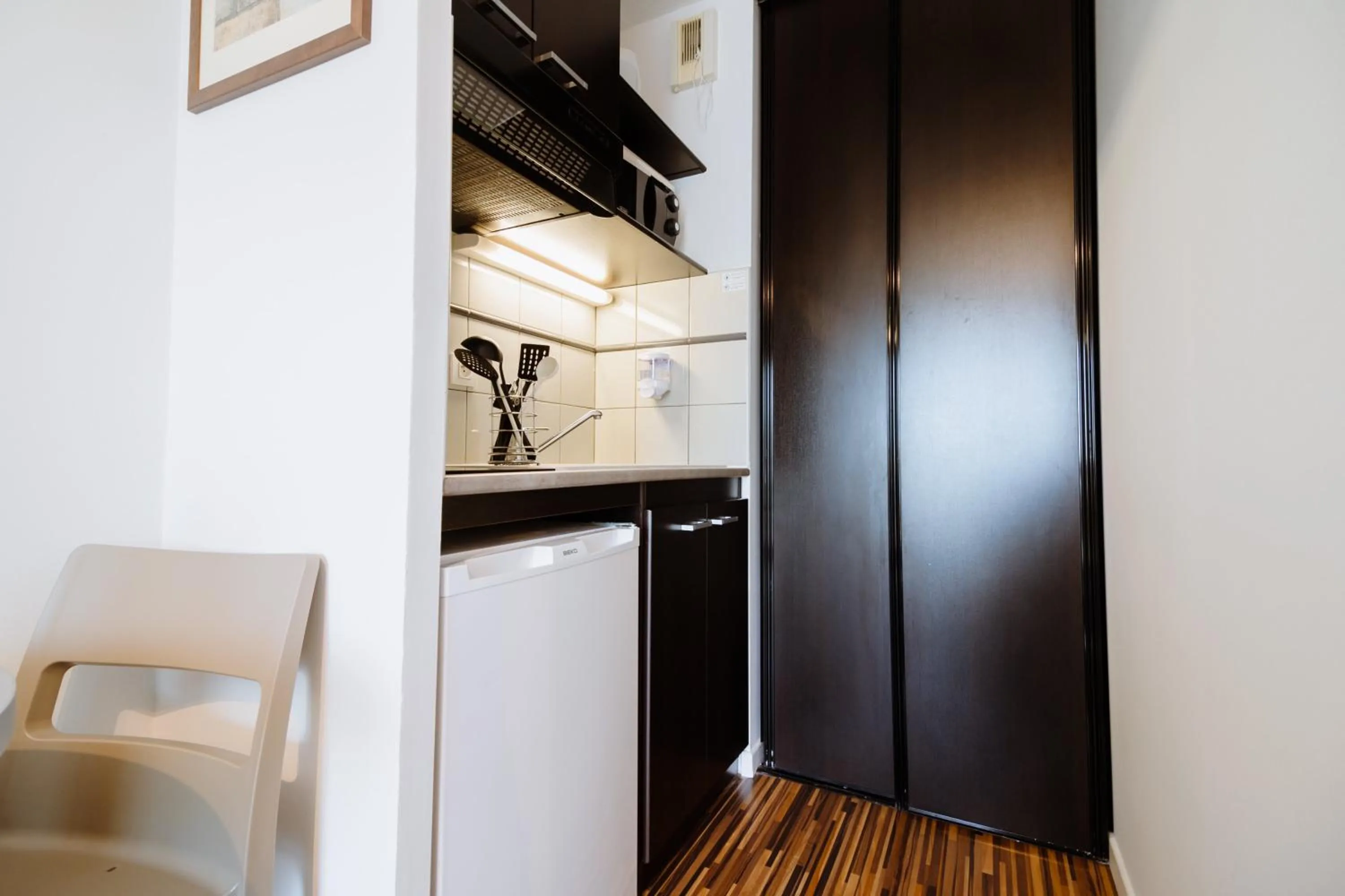 Kitchen or kitchenette in Clarion Aparthotel Toulouse Le Parc de l'Escale