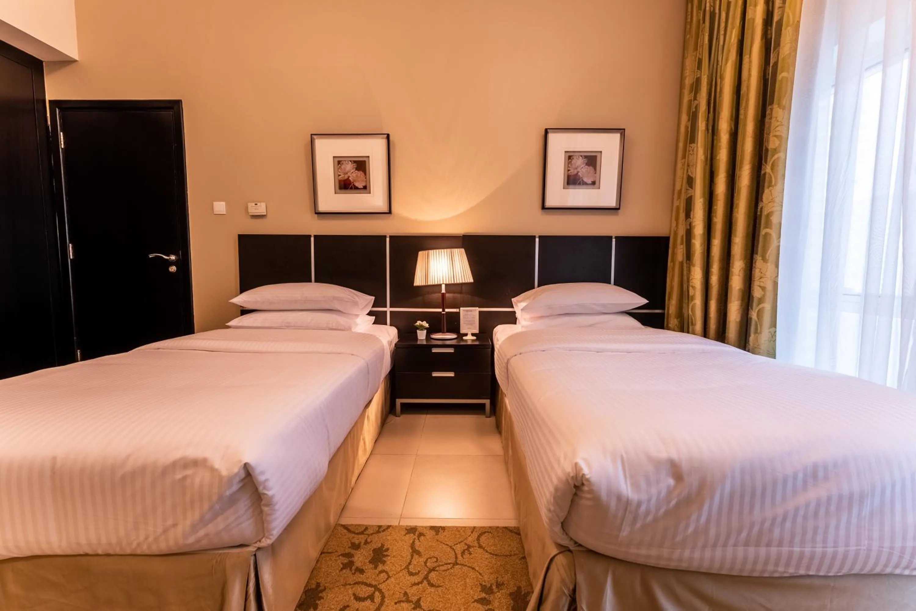 Bed in Gulf Oasis Hotel Apartments Fz LLC