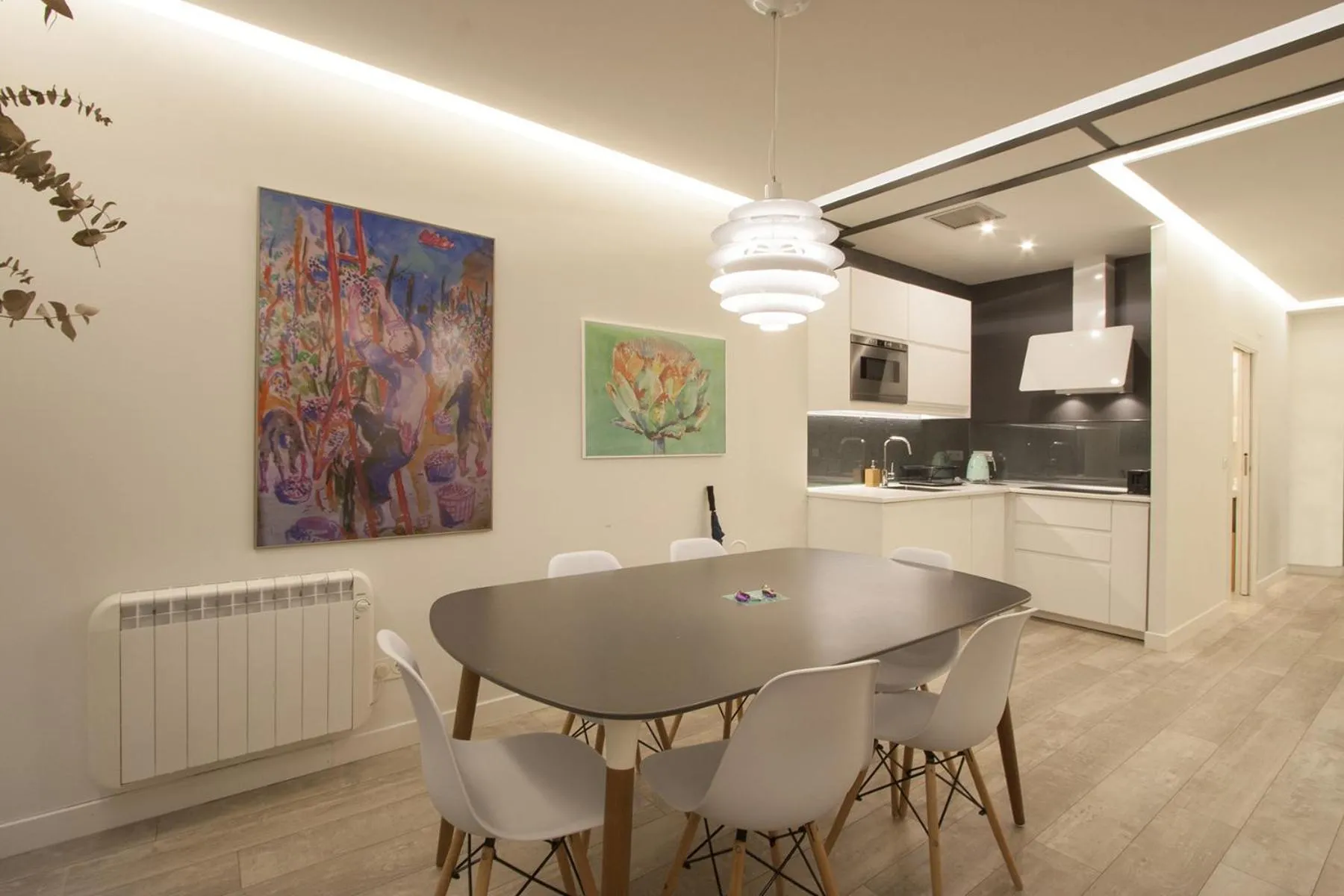 Dining area in Ku by Oldtown San Sebastian apartments