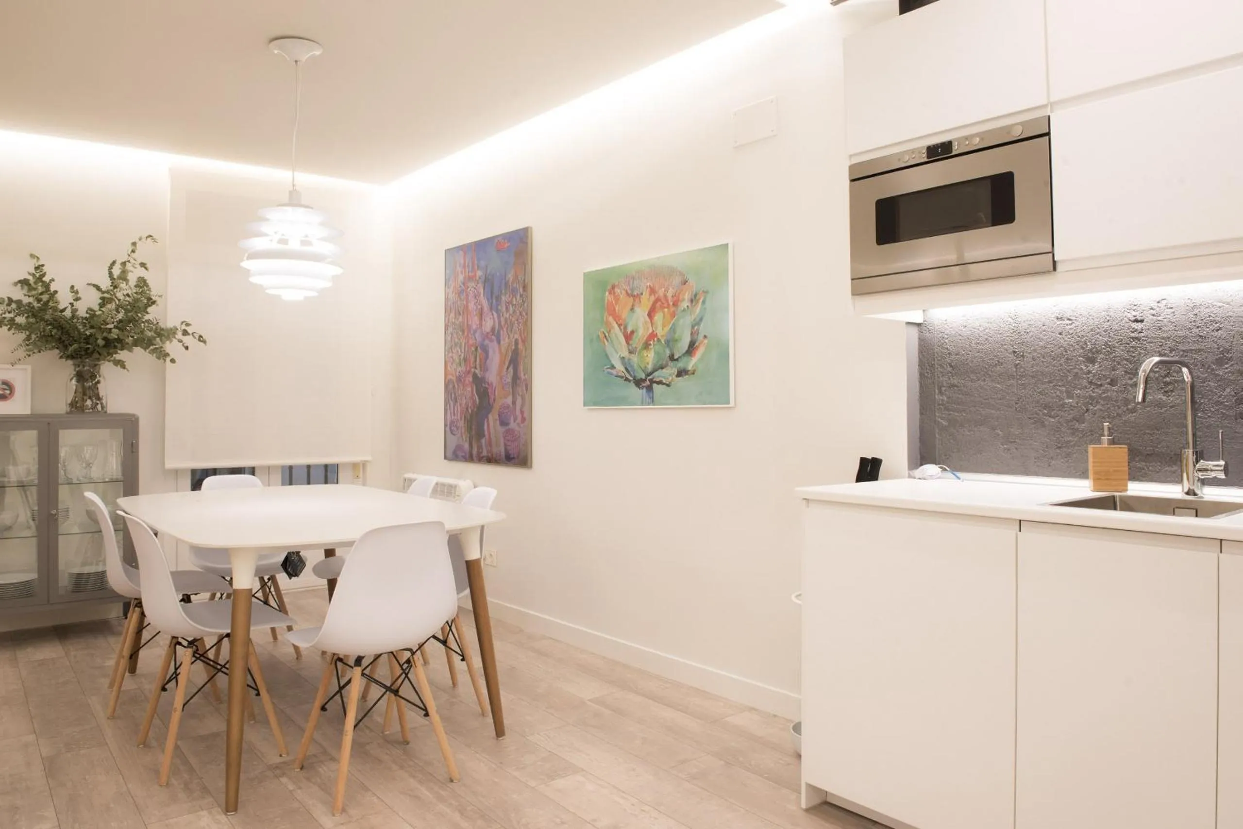Dining area in Ku by Oldtown San Sebastian apartments