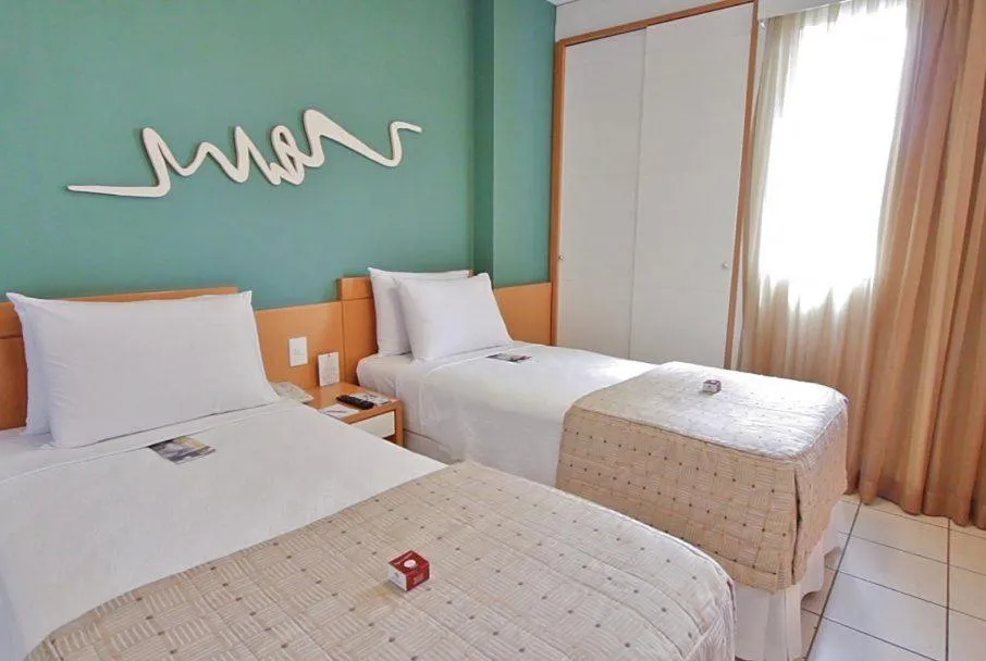 Bed in Praia do Canto Apart Hotel