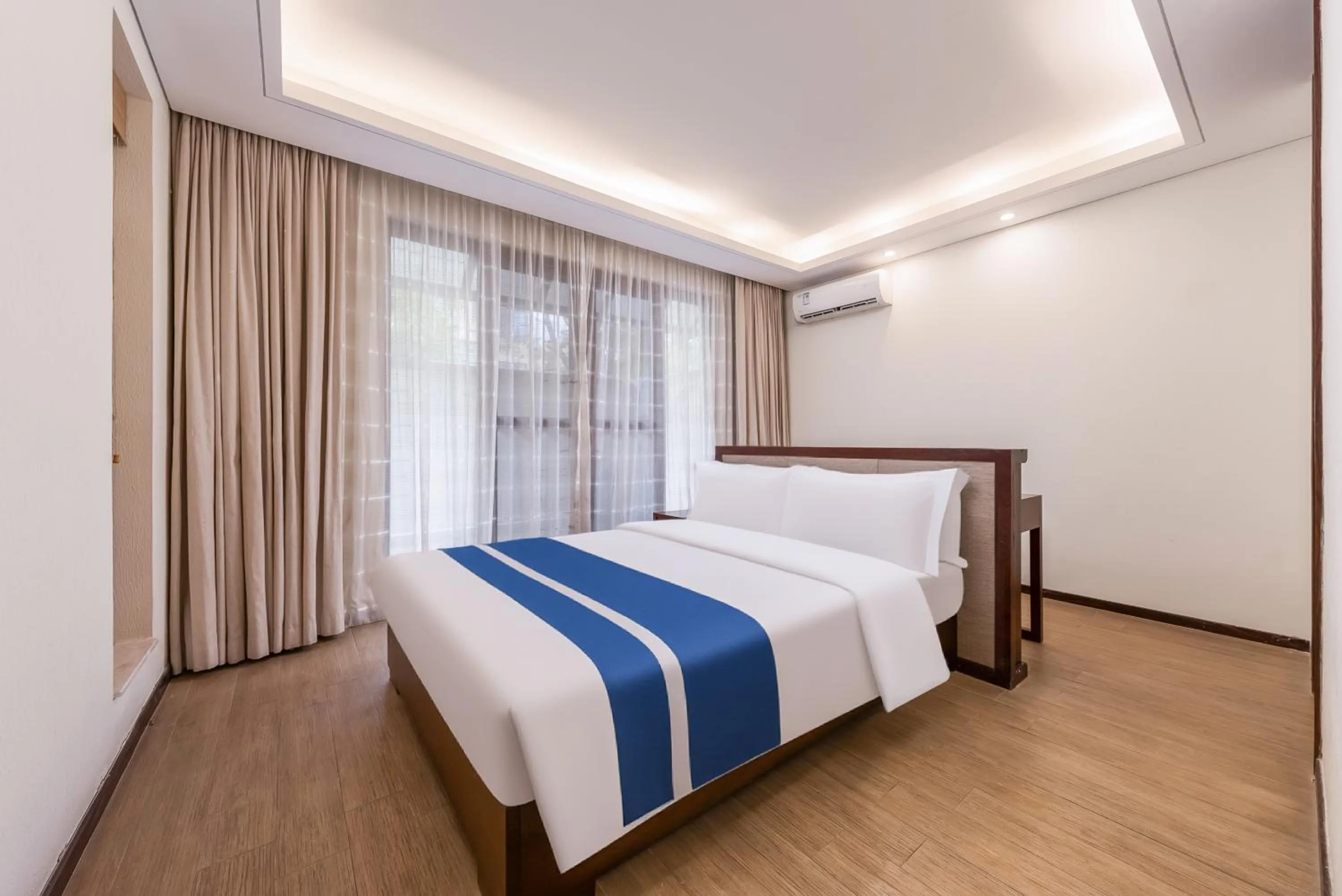 Bed in Iccssi Villa Haitang Bay Sanya