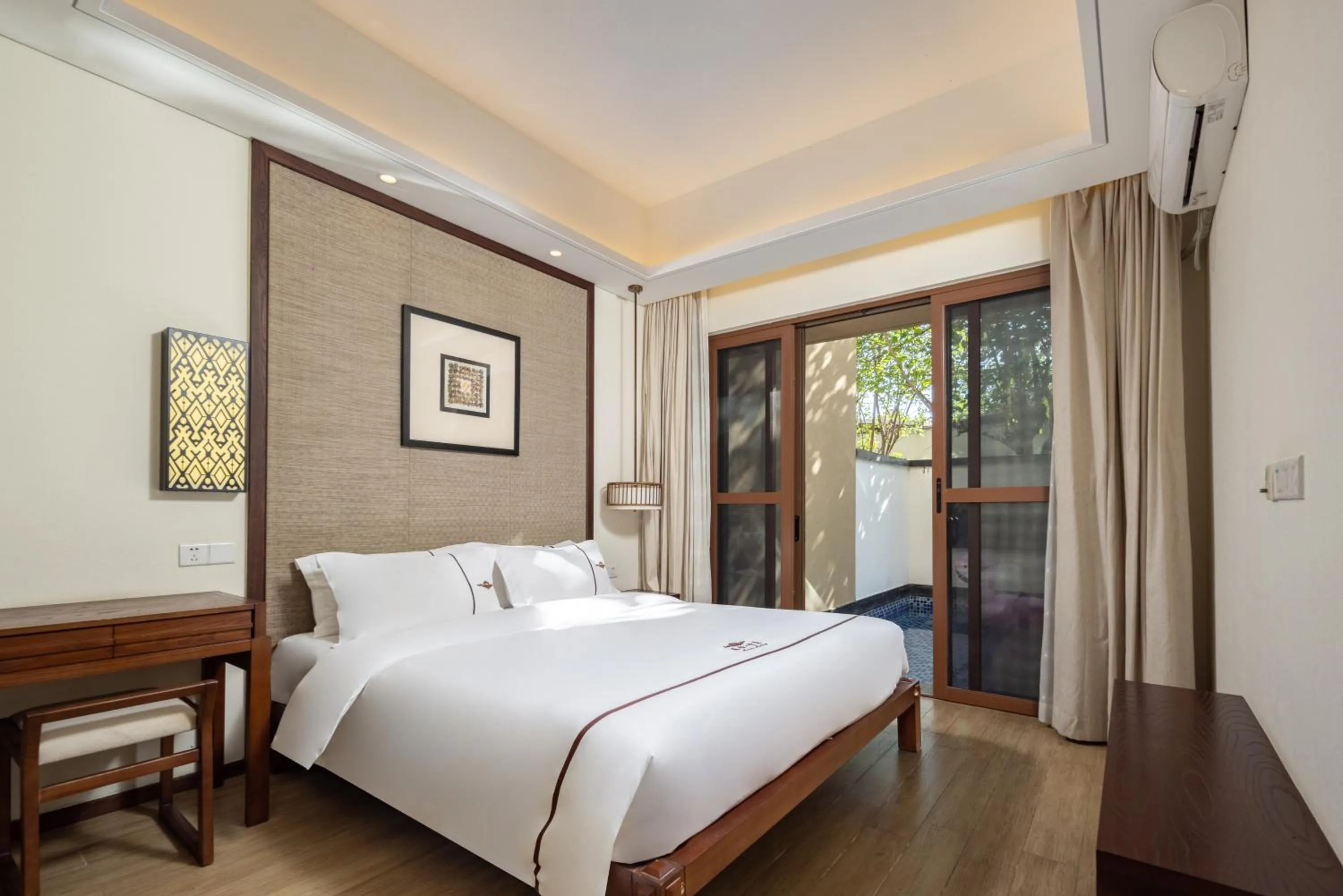 Bed in Iccssi Villa Haitang Bay Sanya