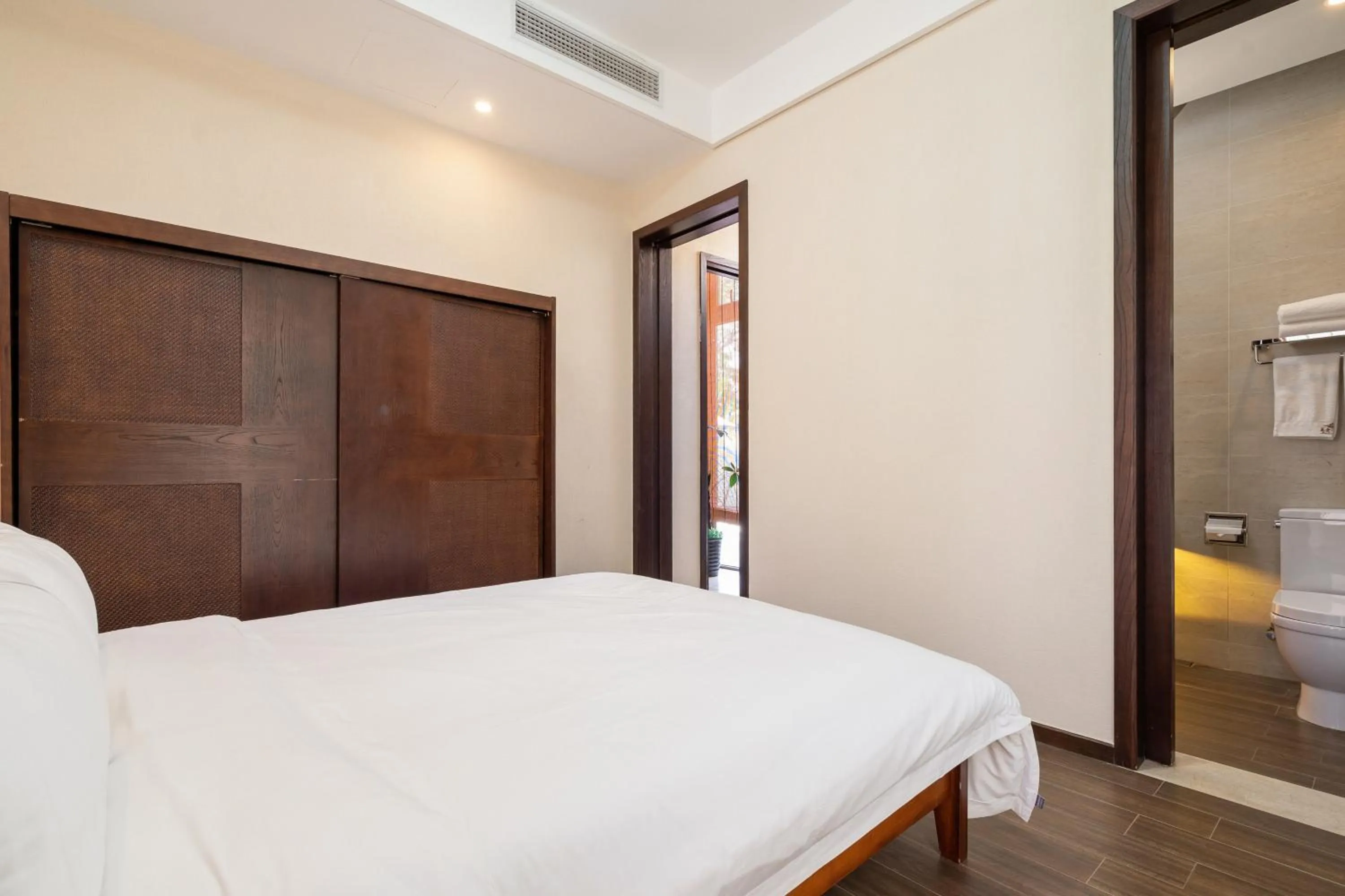 Bed in Iccssi Villa Haitang Bay Sanya