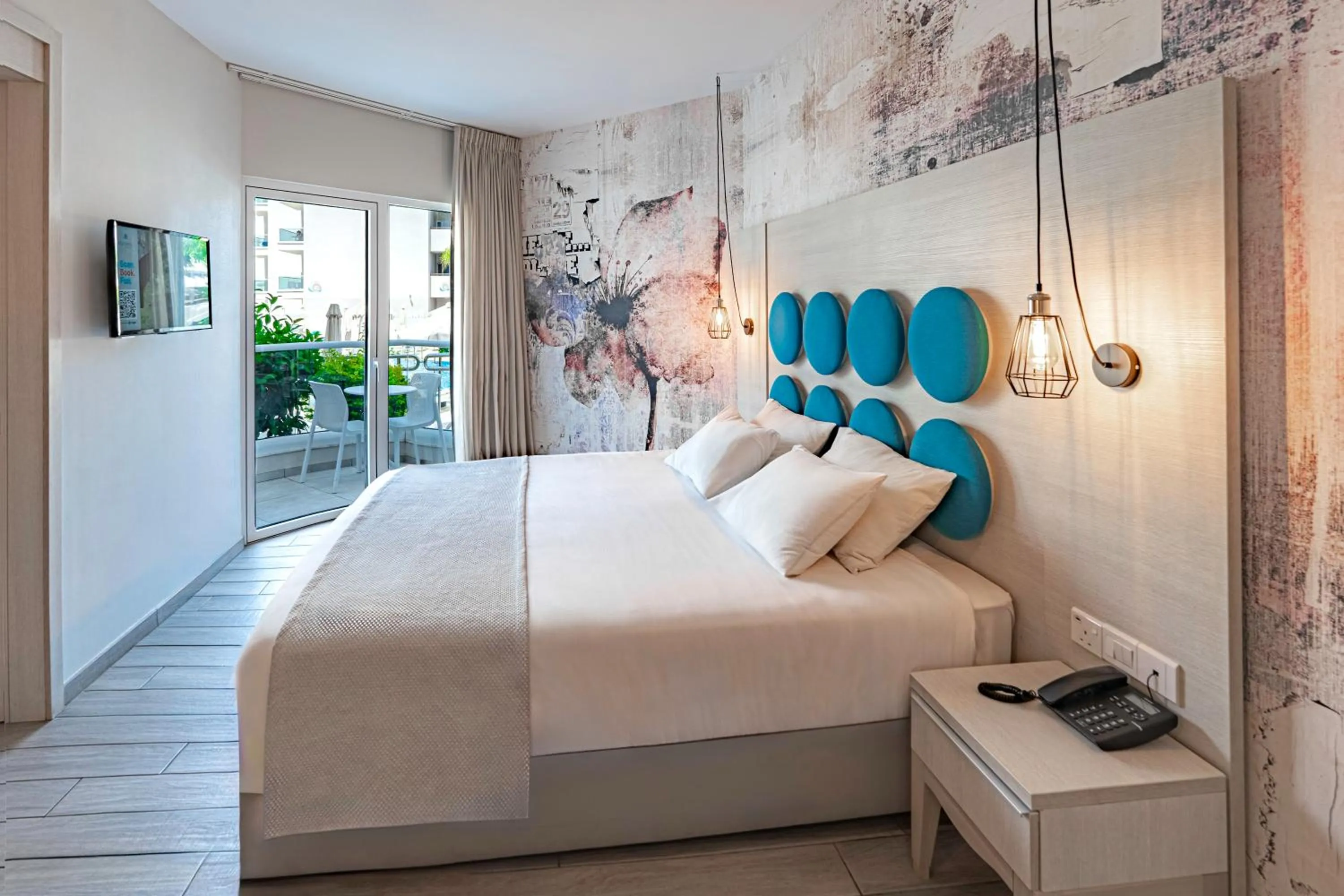 Bed in Vangelis Hotel & Suites