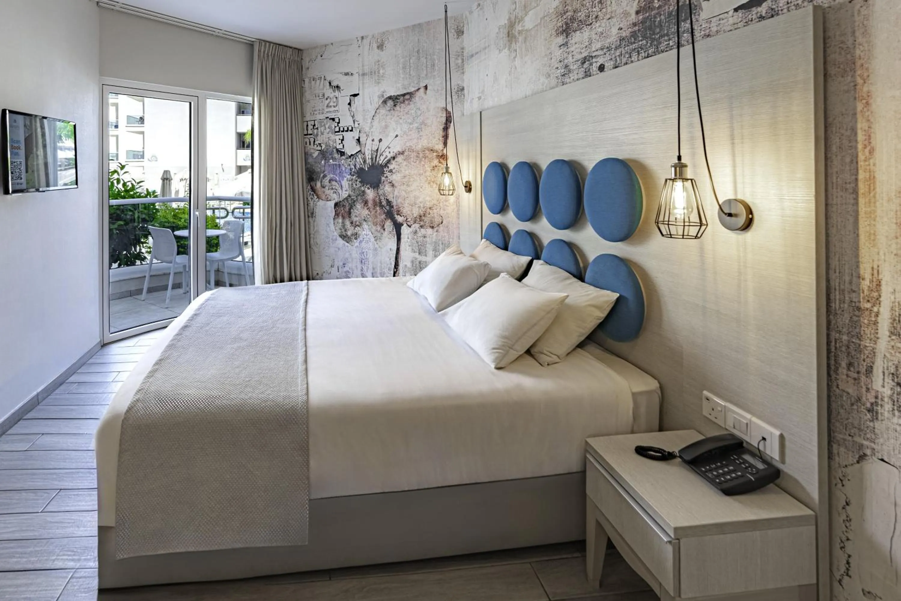 Bed in Vangelis Hotel & Suites