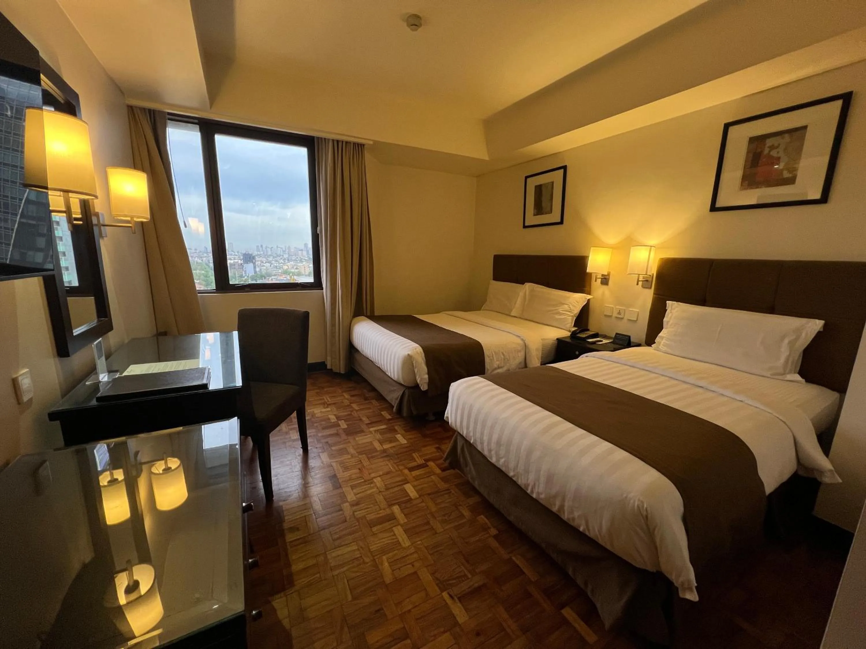 Bed in City Garden Hotel Makati